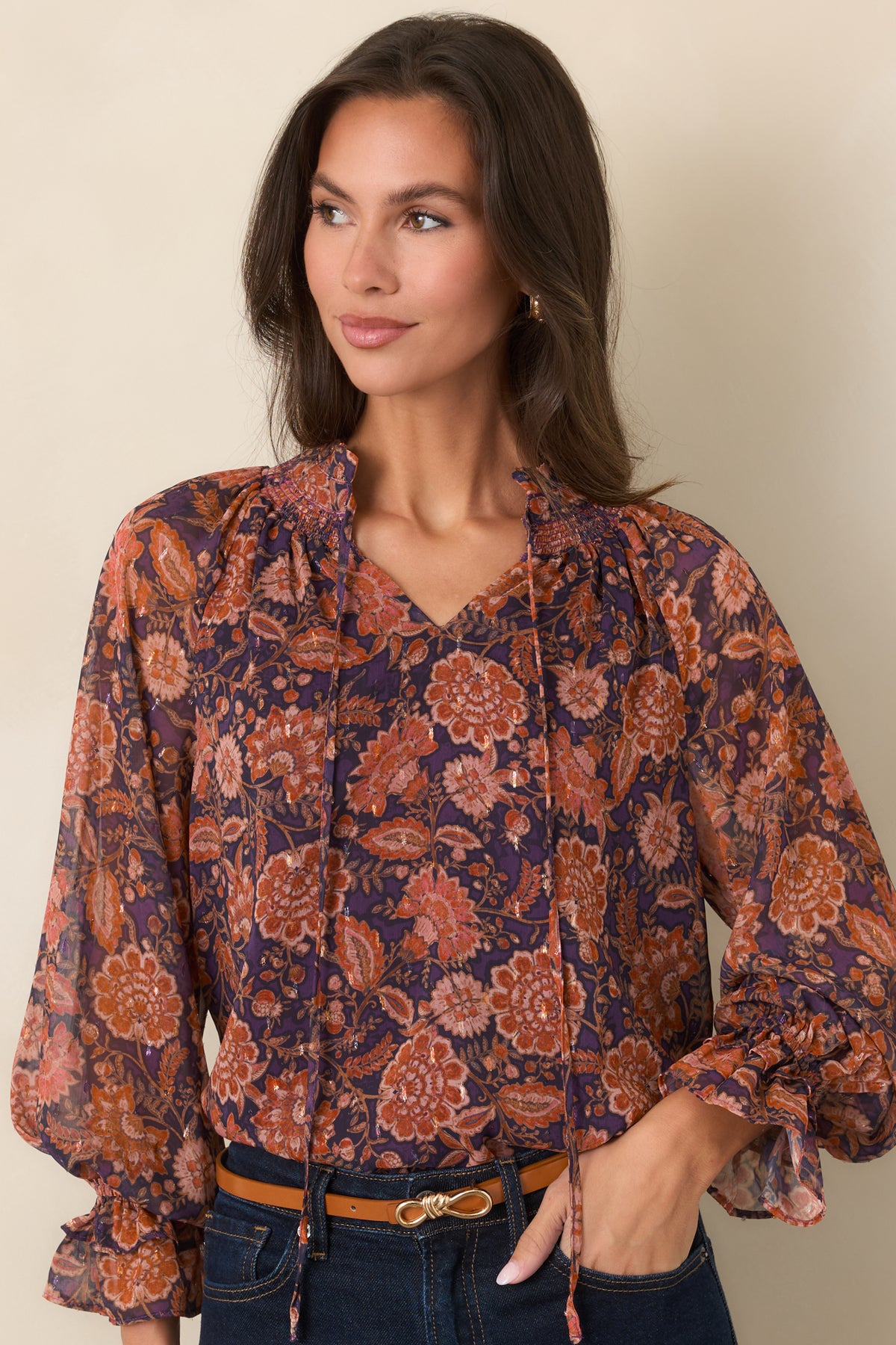 Sheer floral top showcasing plum, rust, coral, and muted pink blooms across the overlay.