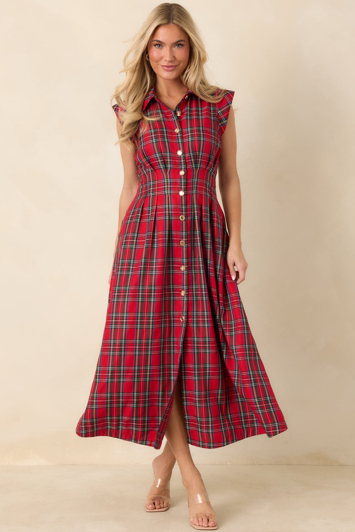 Midi dress with a pointed collar, gold-tone front buttons, structured cap sleeves, and a pleated A-line skirt.
