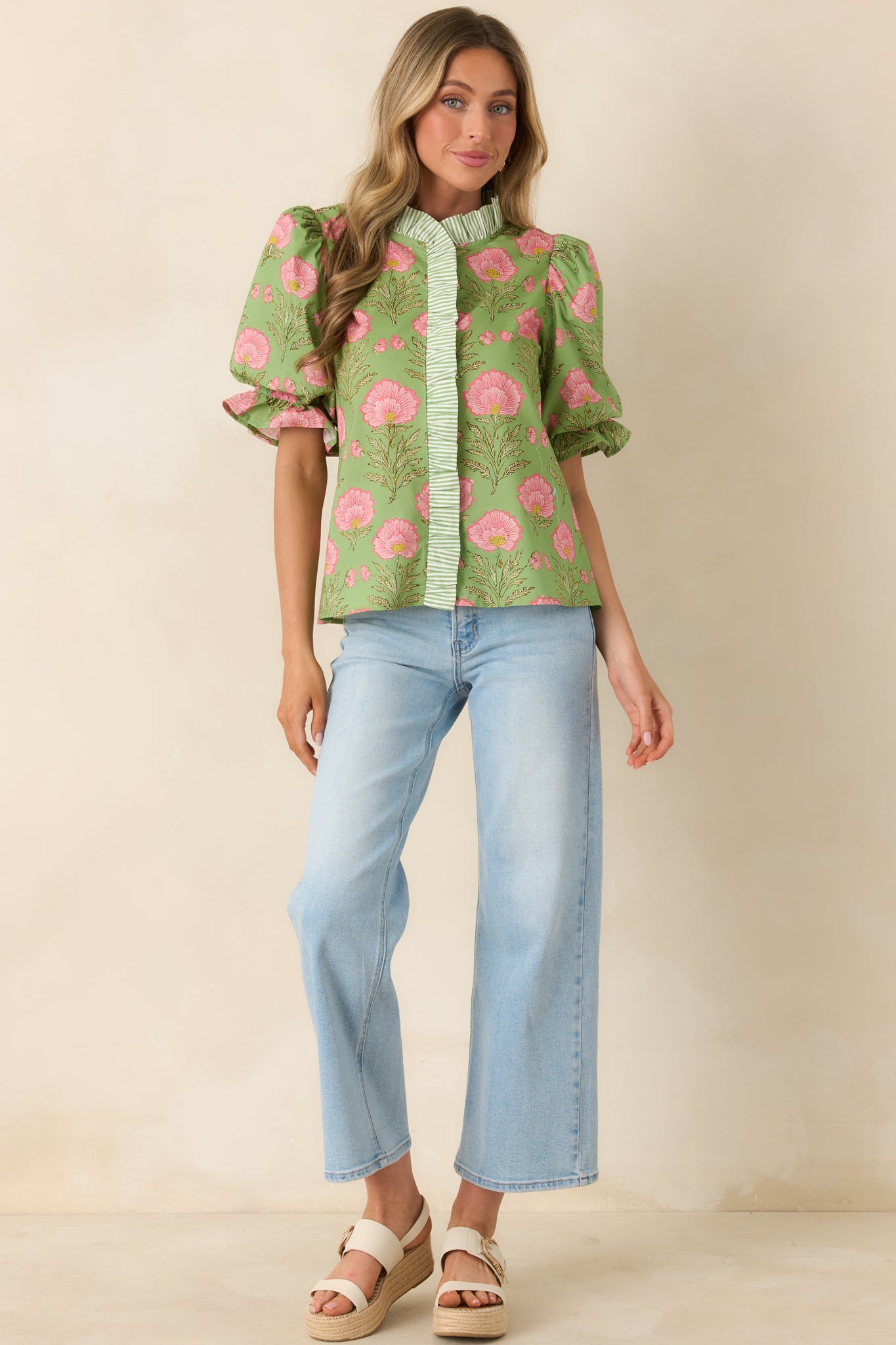 Polished casual top with statement sleeves and clean banded neckline.