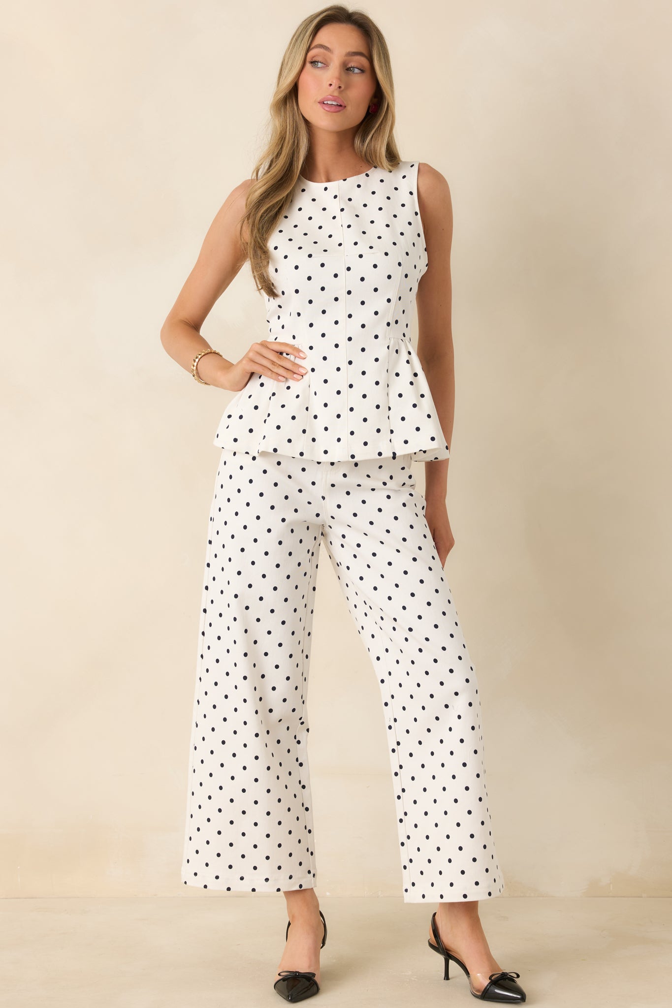 Polka dot high-rise pants featuring a relaxed straight leg and vintage-inspired design.