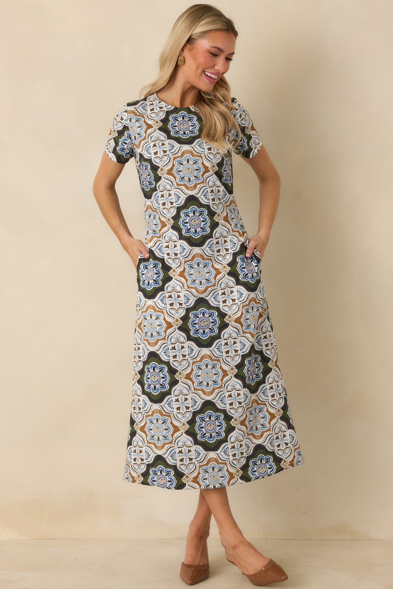 Printed cotton dress showcasing ornate medallion motifs, short sleeves, a round neckline, and softly tailored shape.