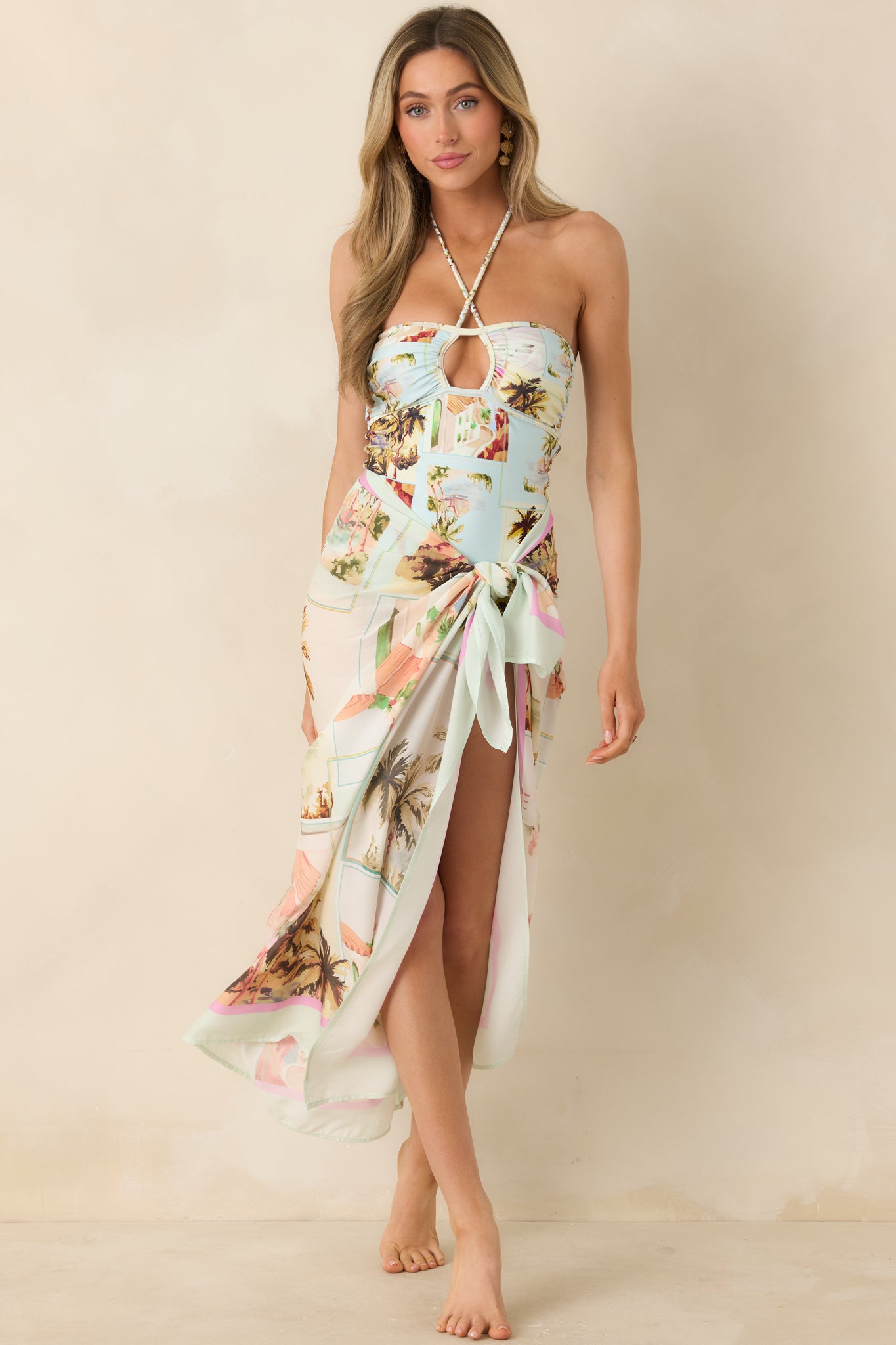 Printed one-piece swimsuit with front keyhole cutout and elongating high-cut leg.