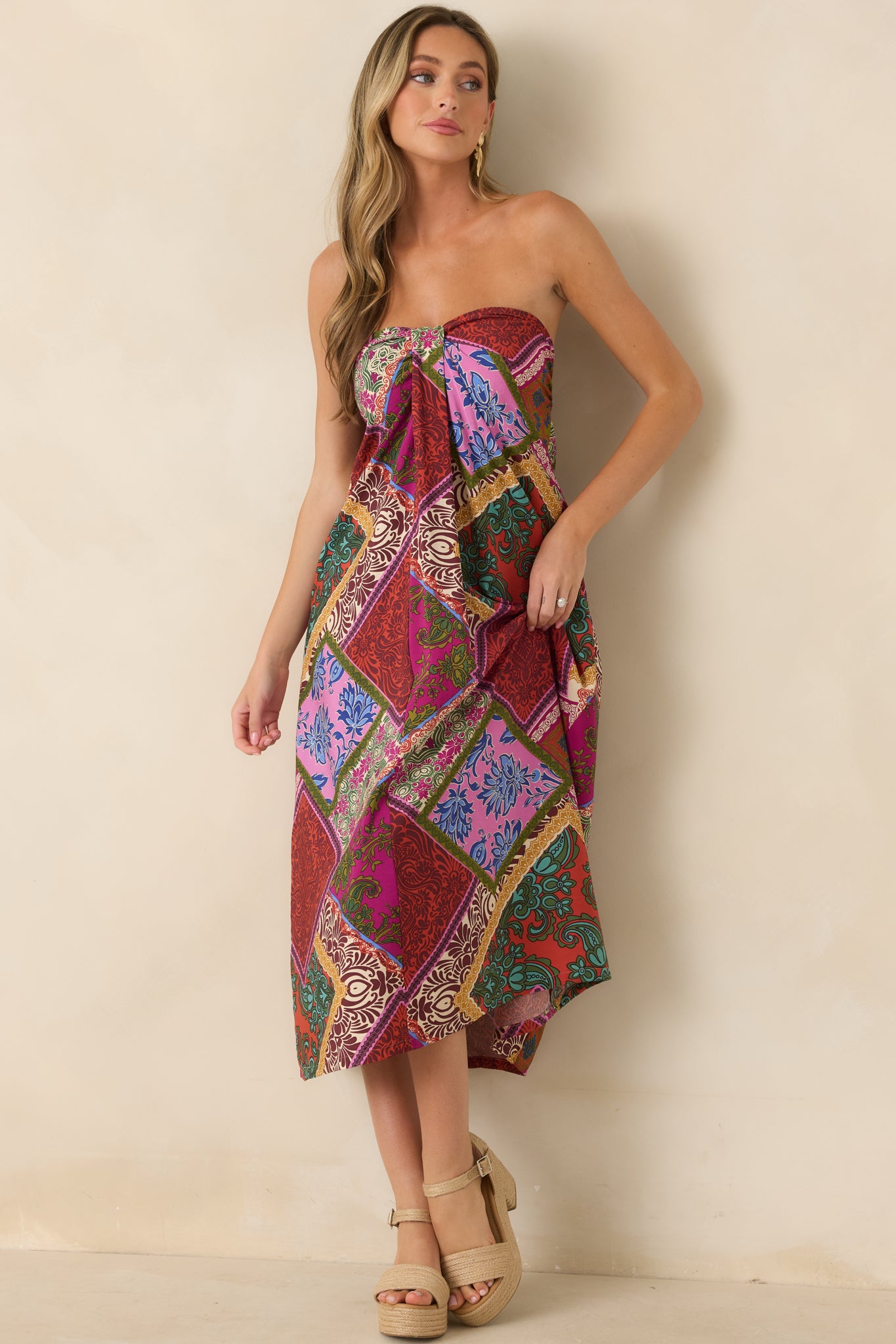 Red patchwork print midi dress with a strapless neckline and softly flowing skirt for an effortless, feminine silhouette.