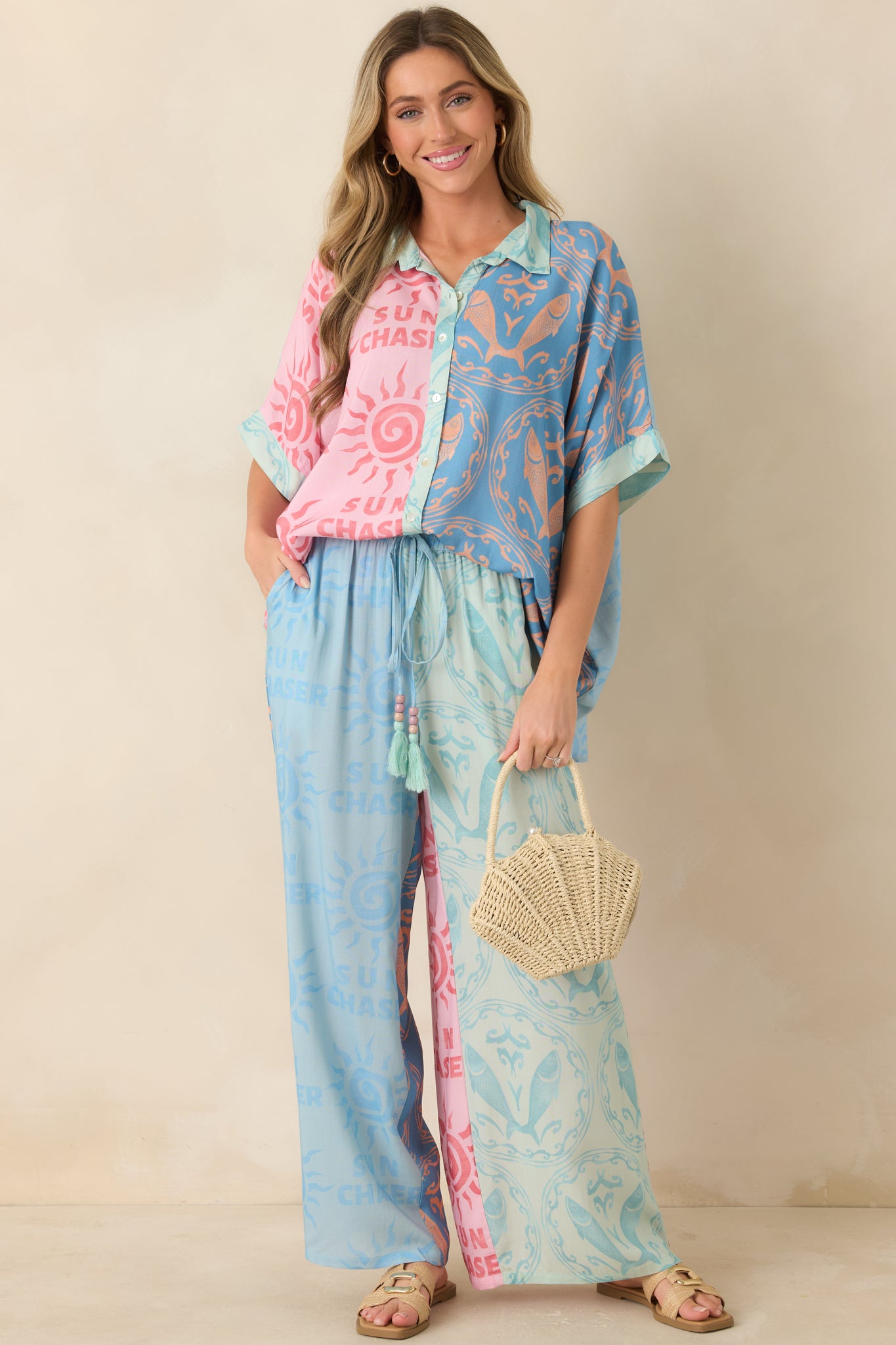 Printed wide leg pants showcasing a relaxed silhouette, bold colorblock design, and fluid breathable viscose material.