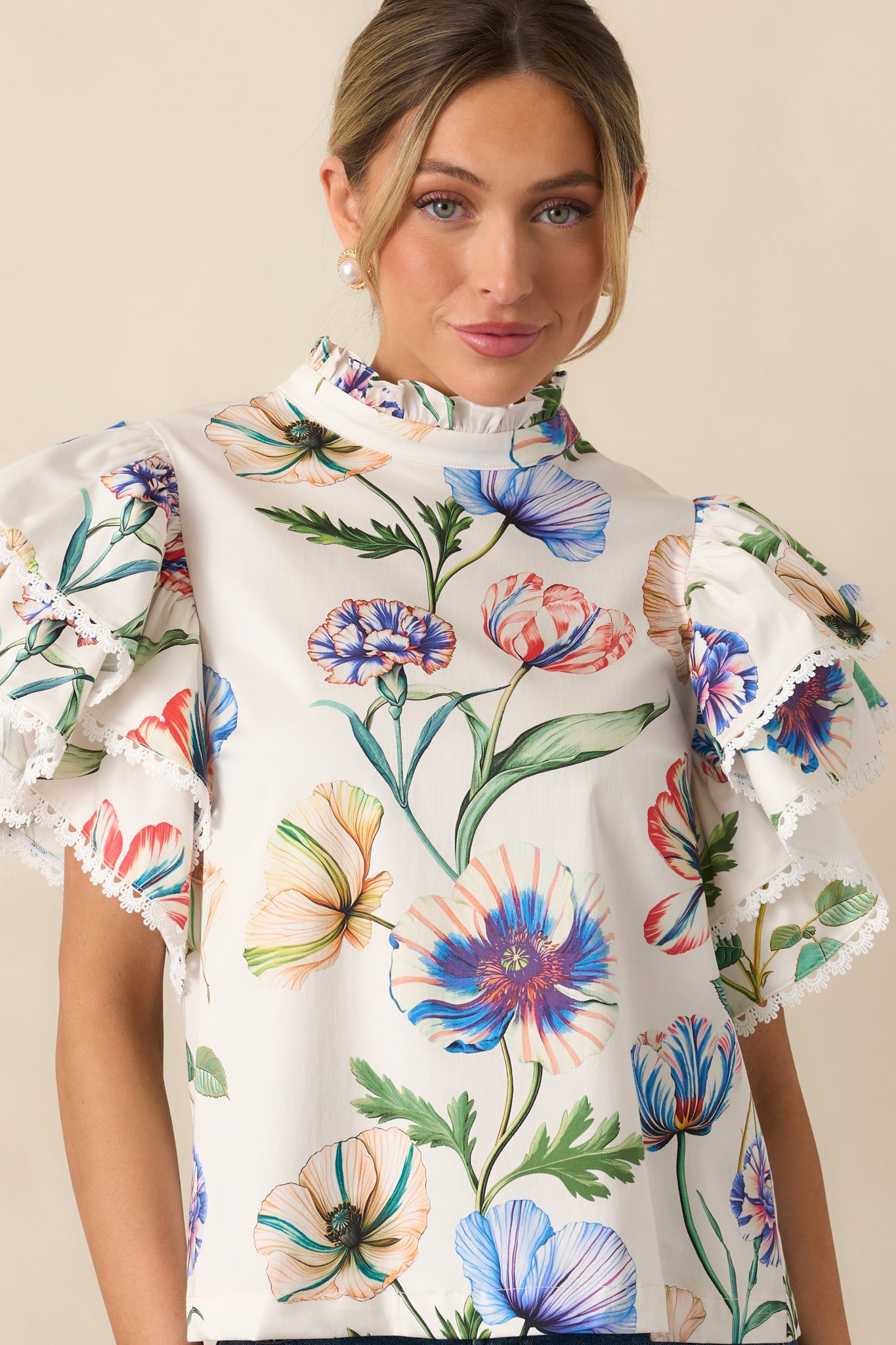 Cropped front view showing floral pattern, ruffle accents, and soft texture.