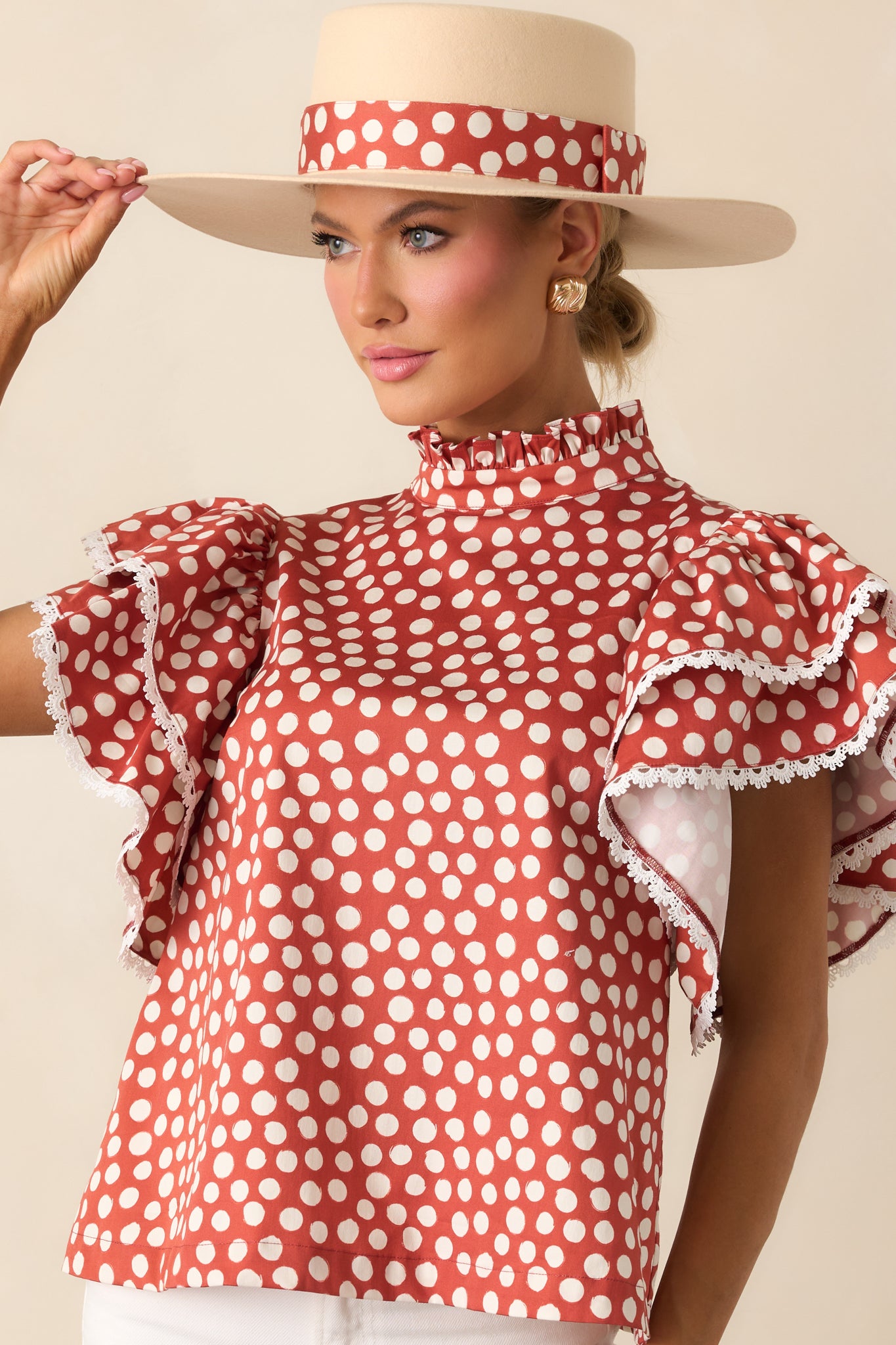 Cropped look at the relaxed-fit polka dot top with subtle ruffle accents.