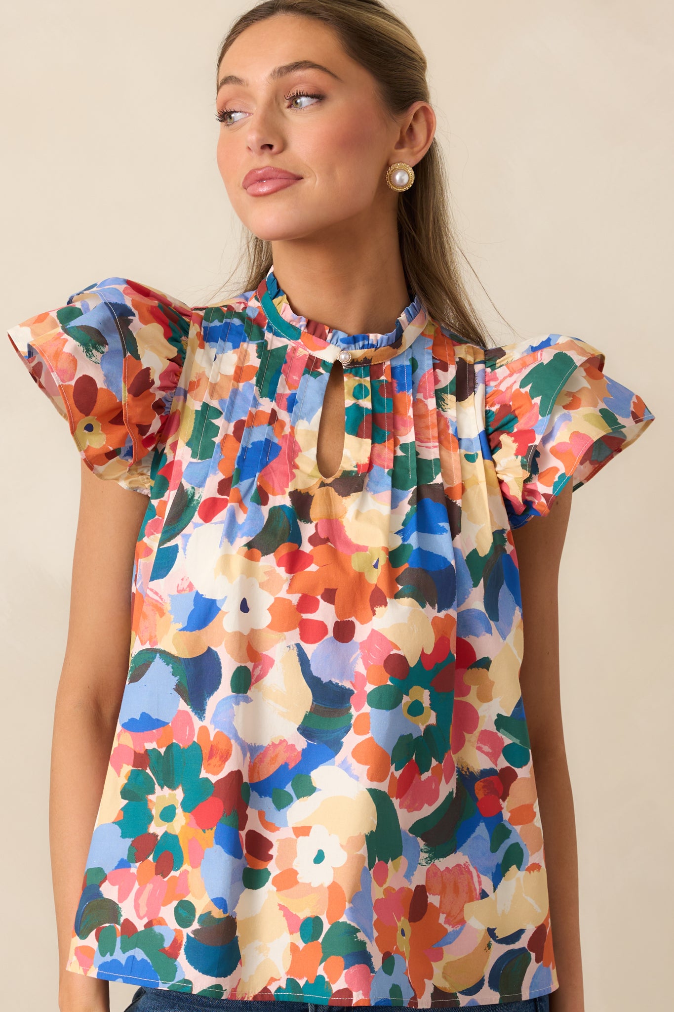 Detail of the pintuck pleat design across the yoke and relaxed fit of the top.