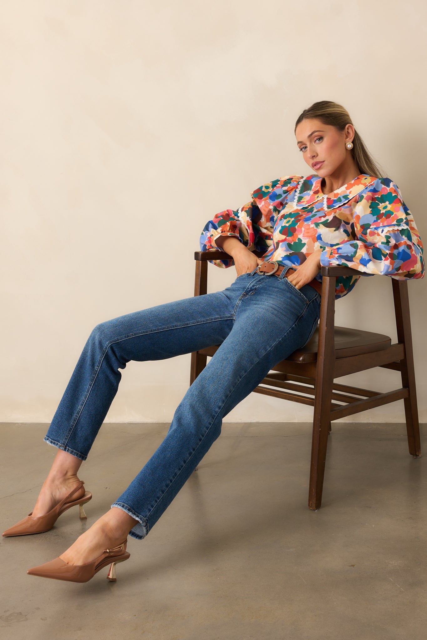 Floral top with peter pan collar and soft, airy fit highlighting lace trim details.