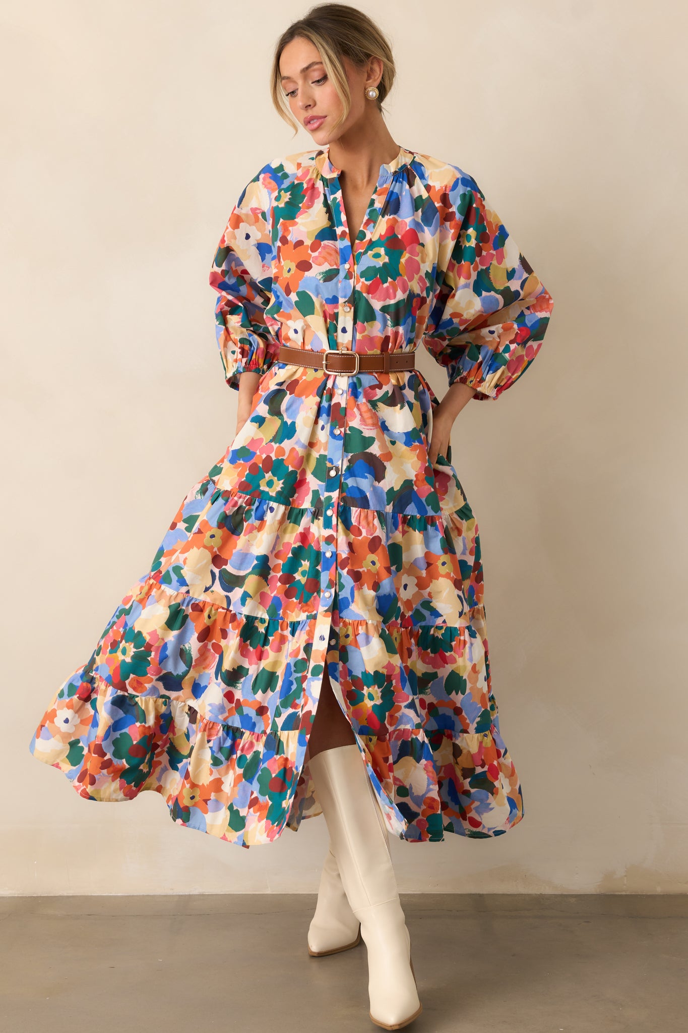 Colorful Prosperina maxi dress featuring a notch v-neck, flowing tiers, and handy side pockets for a touch of practicality.