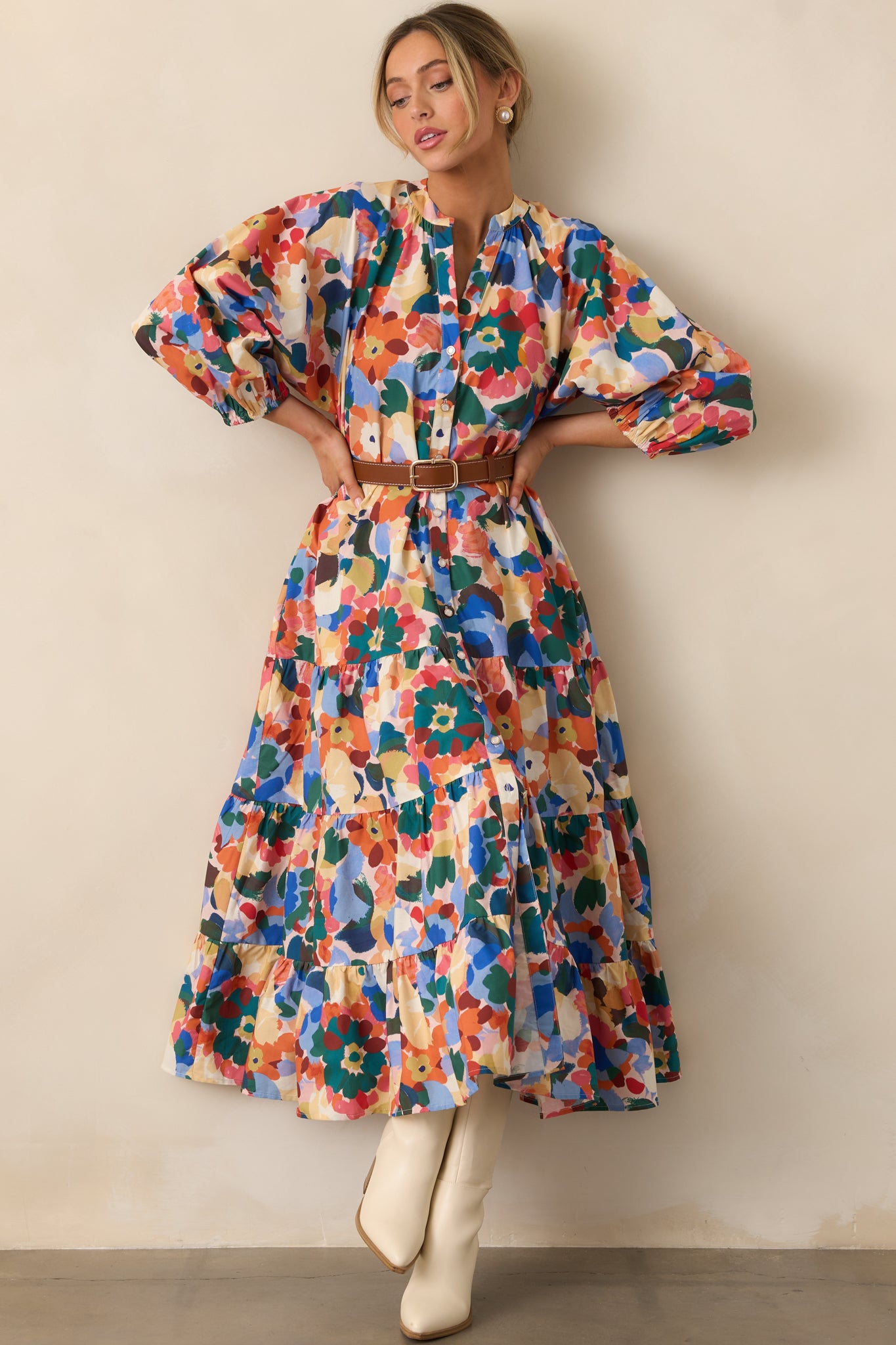 Vibrant orange floral maxi dress with tiered skirt and puff sleeves, perfect for a breezy, effortless look.