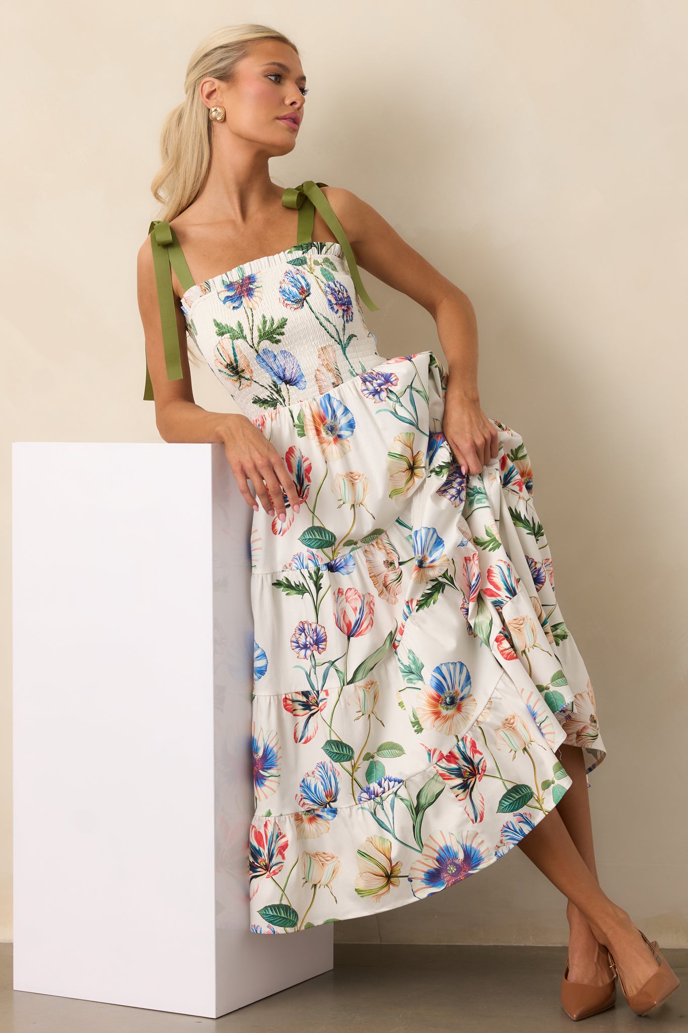 Tiered ivory floral midi dress with ruffle-trimmed square neckline and functional pockets for effortless style.