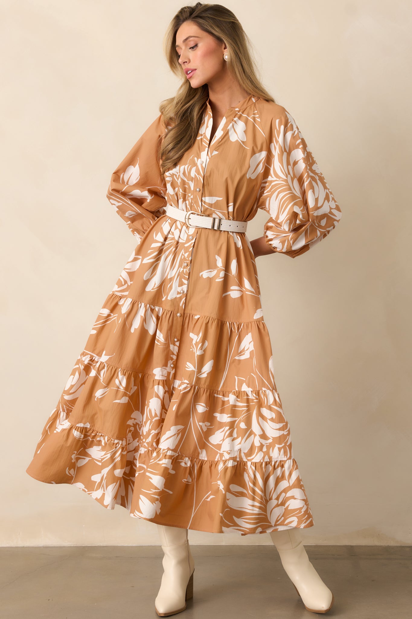 Tiered maxi dress in fawn brown floral print with structured puff sleeves and button details.