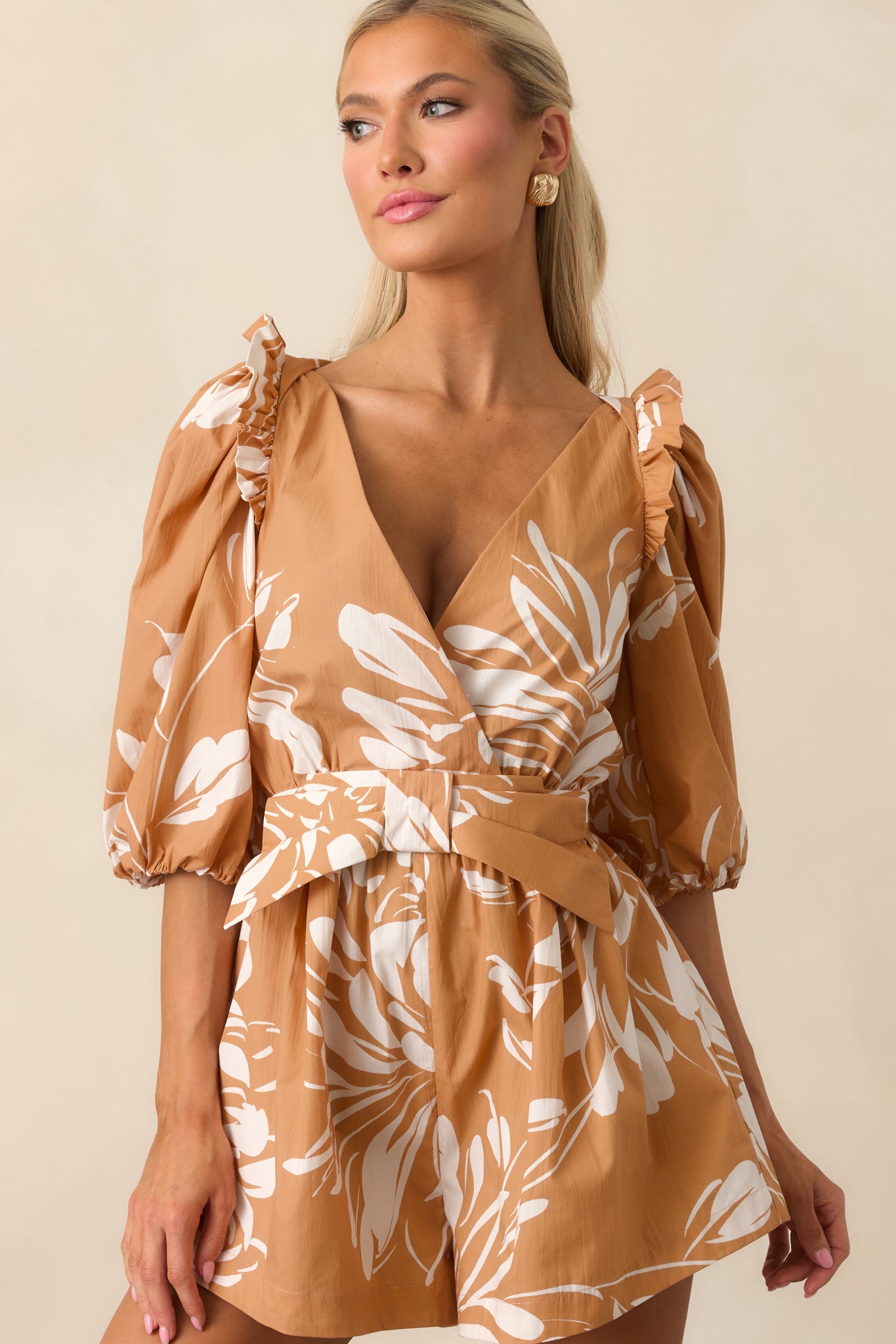 Cropped front view emphasizing the decorative bow detail and floral print pattern.