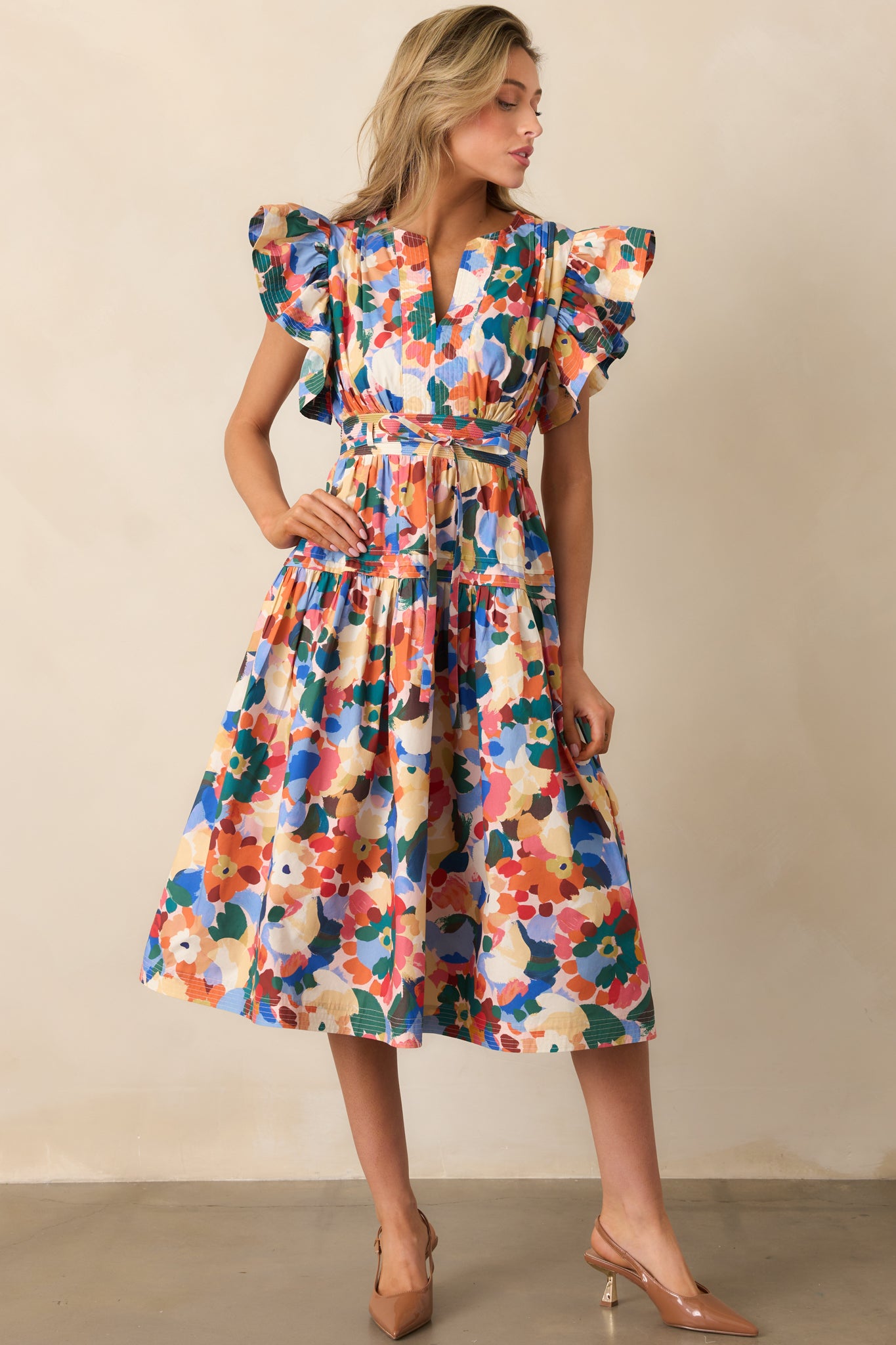 Short-sleeve floral midi dress with a smocked back waist and playful ruffle accents.