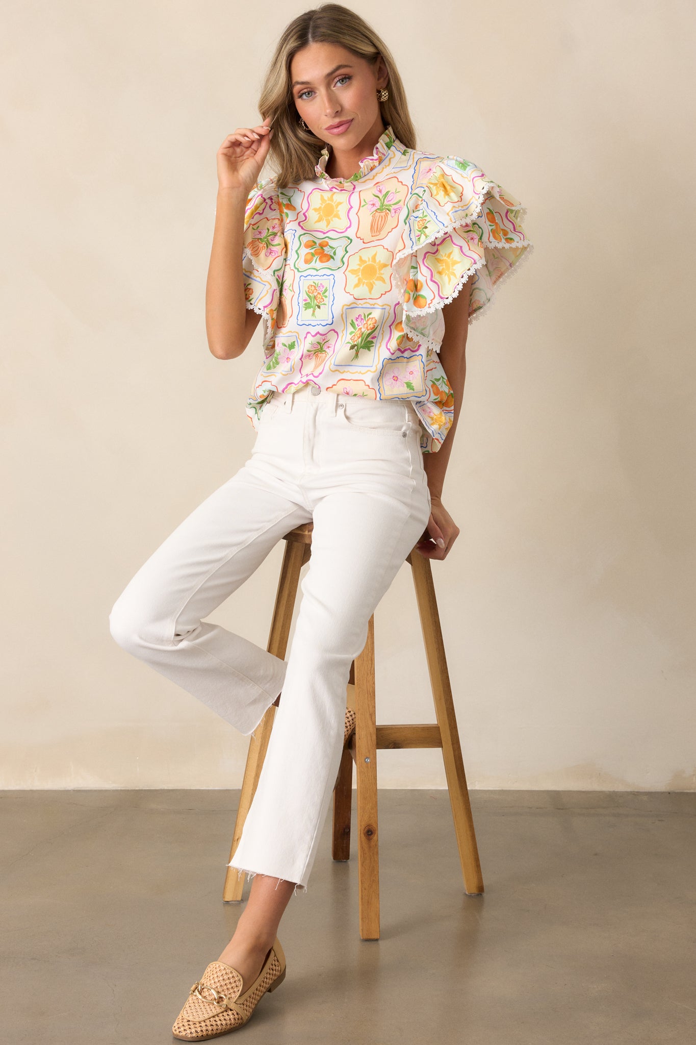 Full-length image showcasing the structured mock neck ruffle and airy silhouette of the patchwork top.