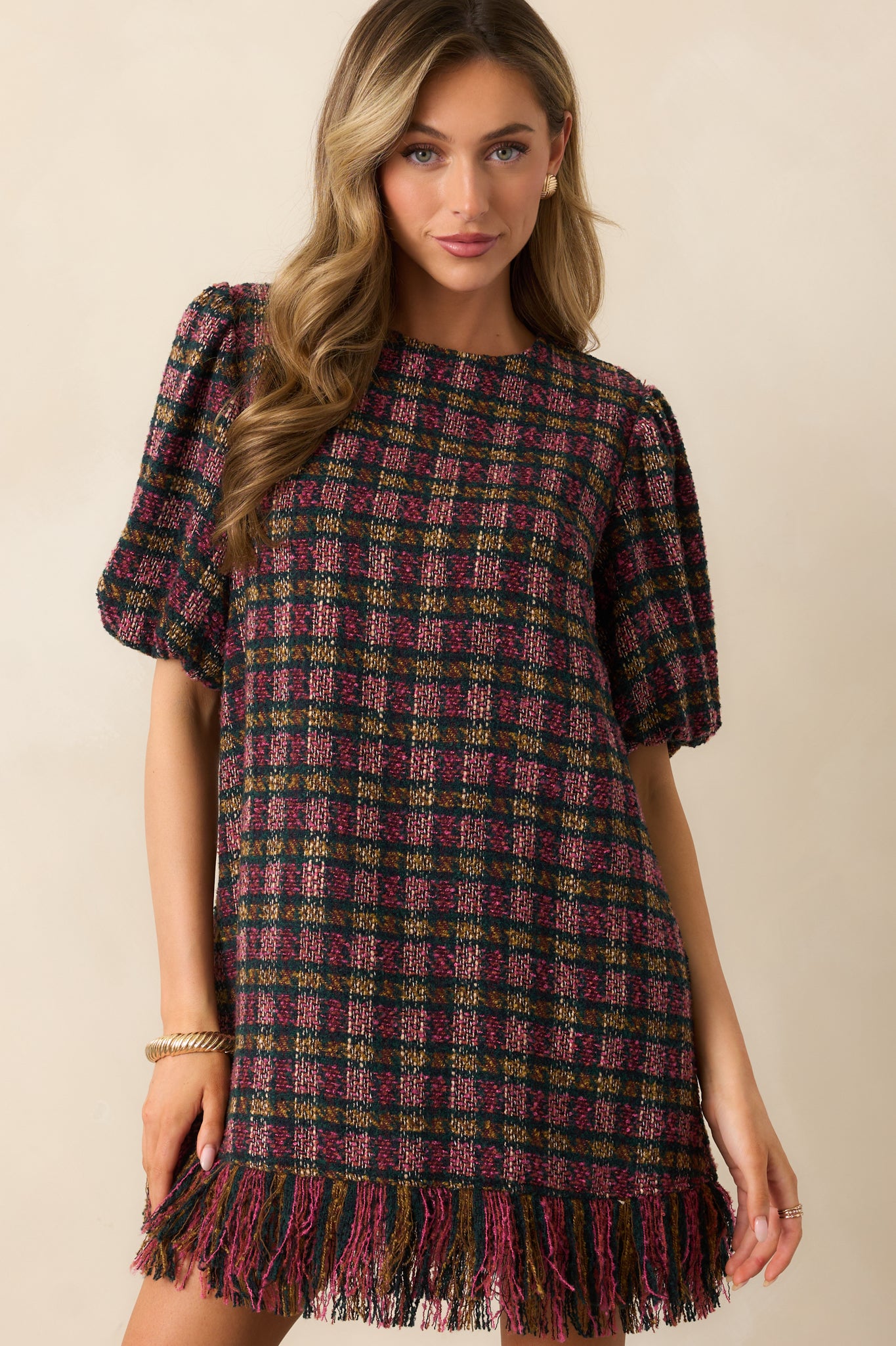 Focus on the fringed hemline highlighting the textured finish of the multicolor tweed.
