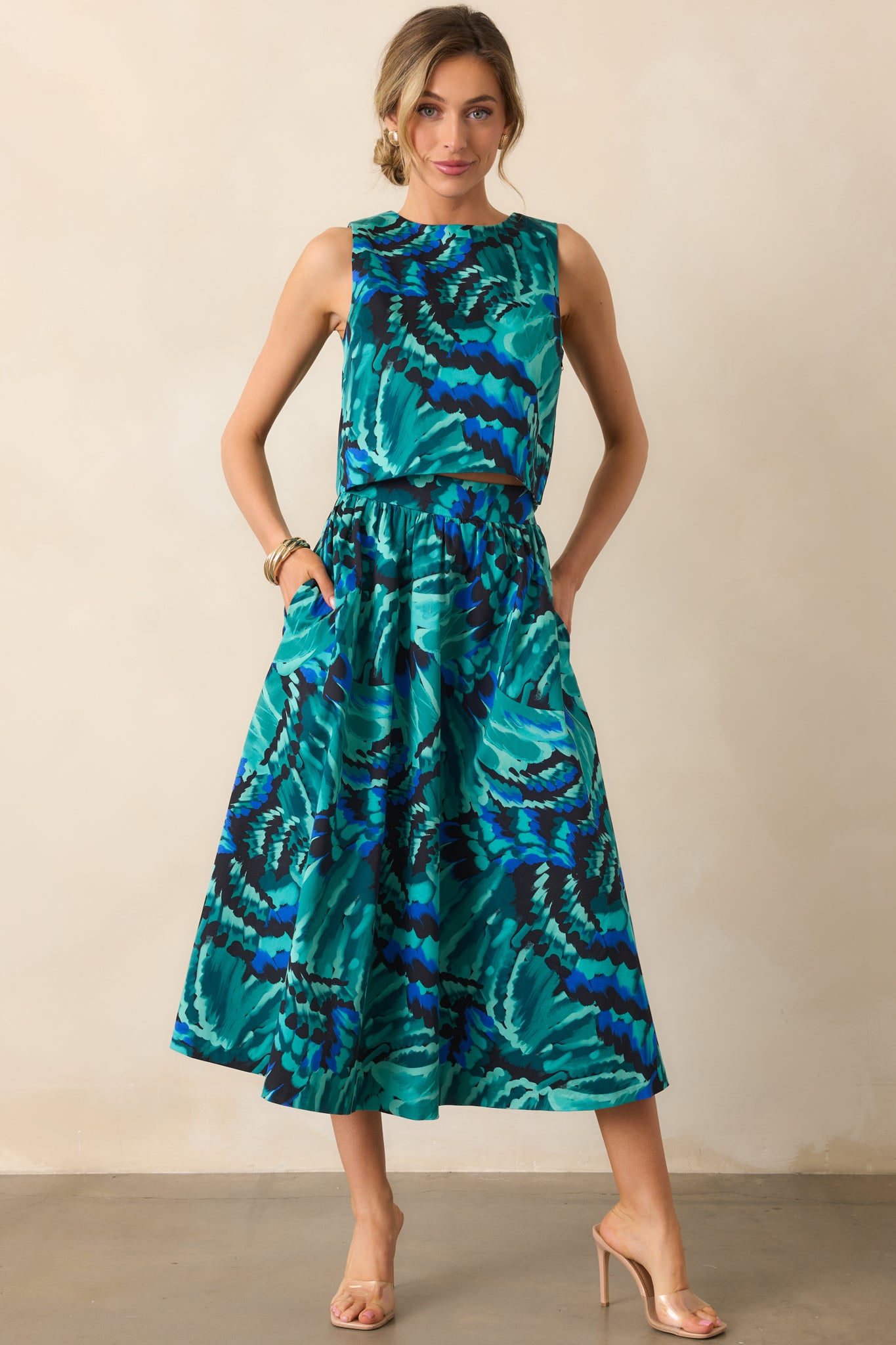 Vibrant multicolor midi skirt highlighting the flowing fabric and side pocket details.