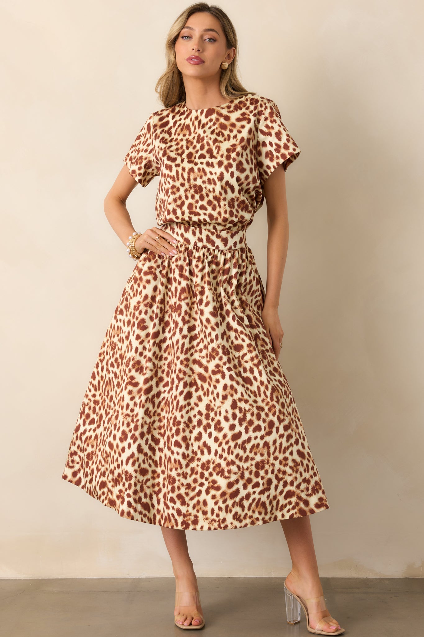 Leopard print short-sleeve top highlighting the straight hem and casual style.