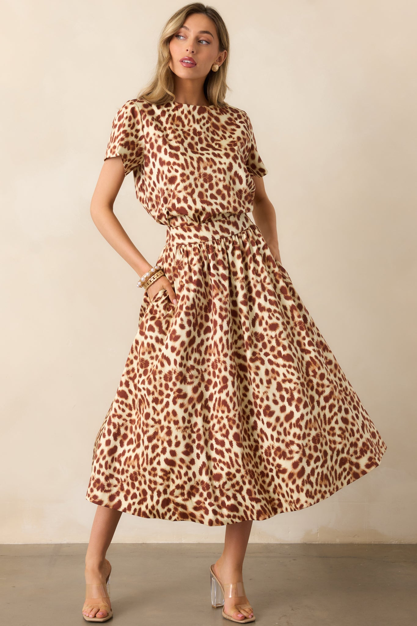 Ivory and brown leopard print top with a boxy silhouette and short sleeves.