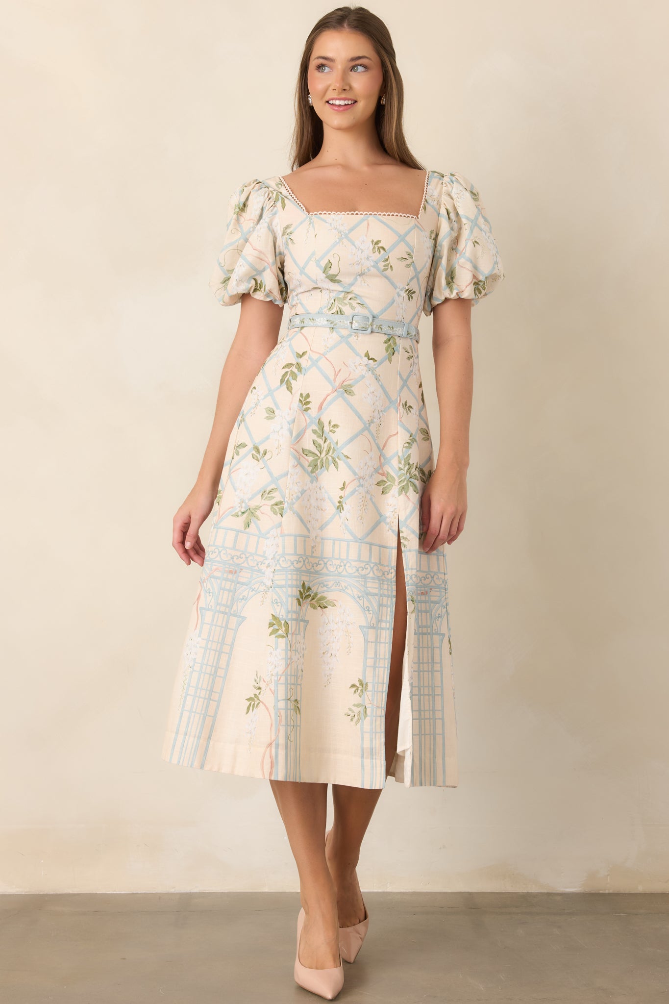 Puff-sleeve midi dress featuring a coordinating buckled waist belt