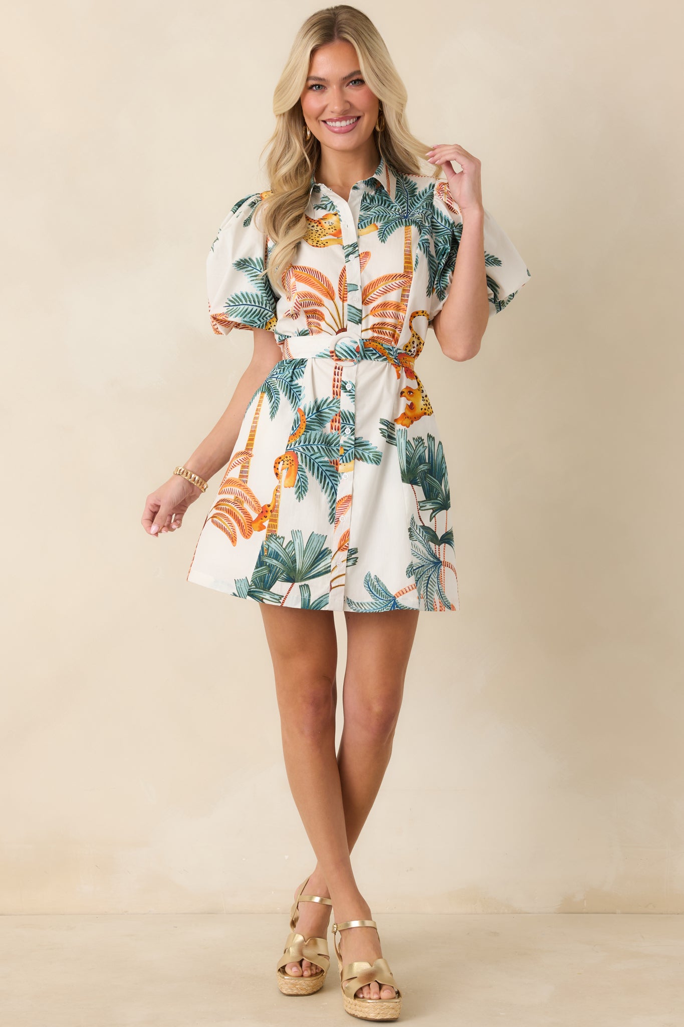 Puff sleeve mini dress with relaxed fit and flattering cinched waist shape.
