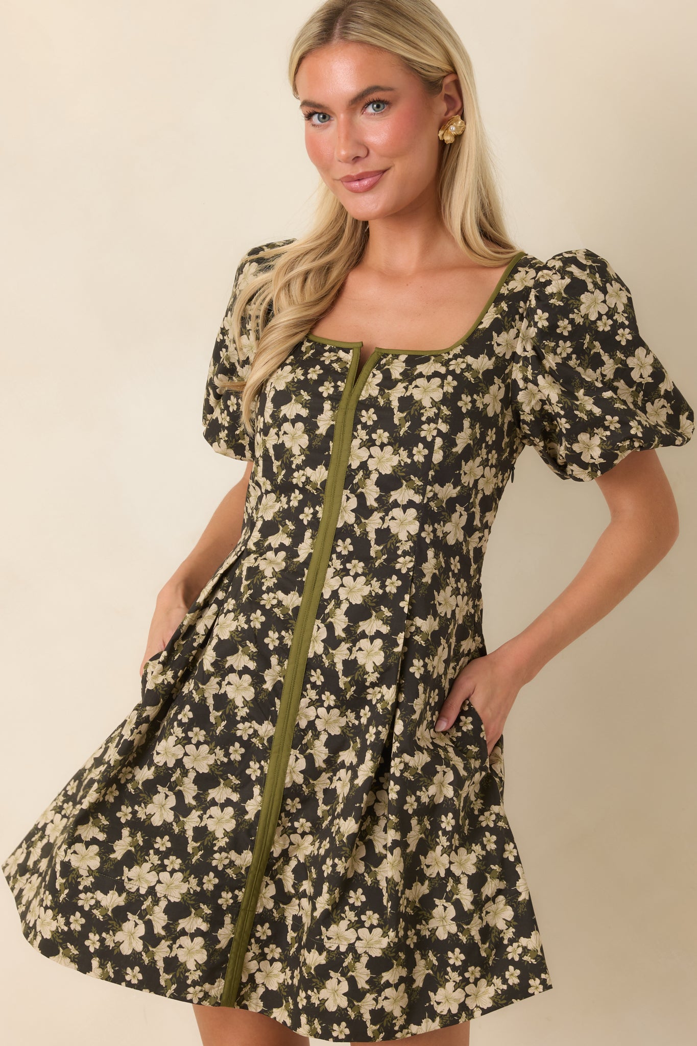 Detailed view of the mini dress highlighting the puff sleeves and contrast front panel with olive green accents.