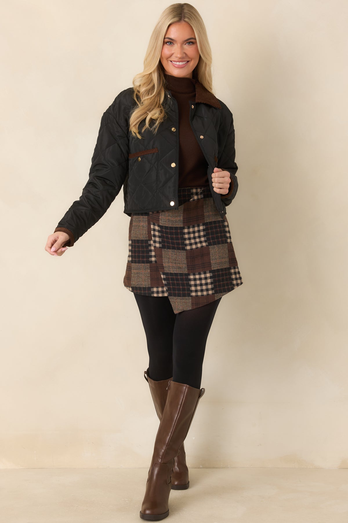 Quilted jacket featuring a heritage-inspired brown collar, long sleeves, and a slightly cropped silhouette.