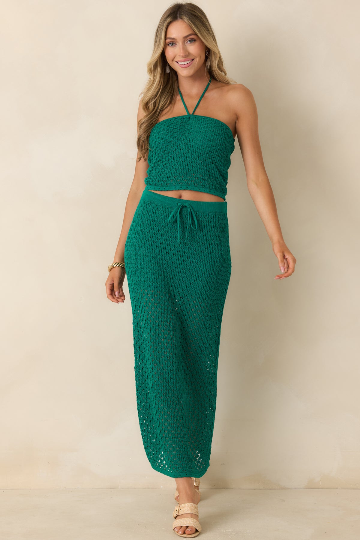 Rainforest green crochet cropped top featuring a straight neckline, fitted silhouette, and textured open-knit design.