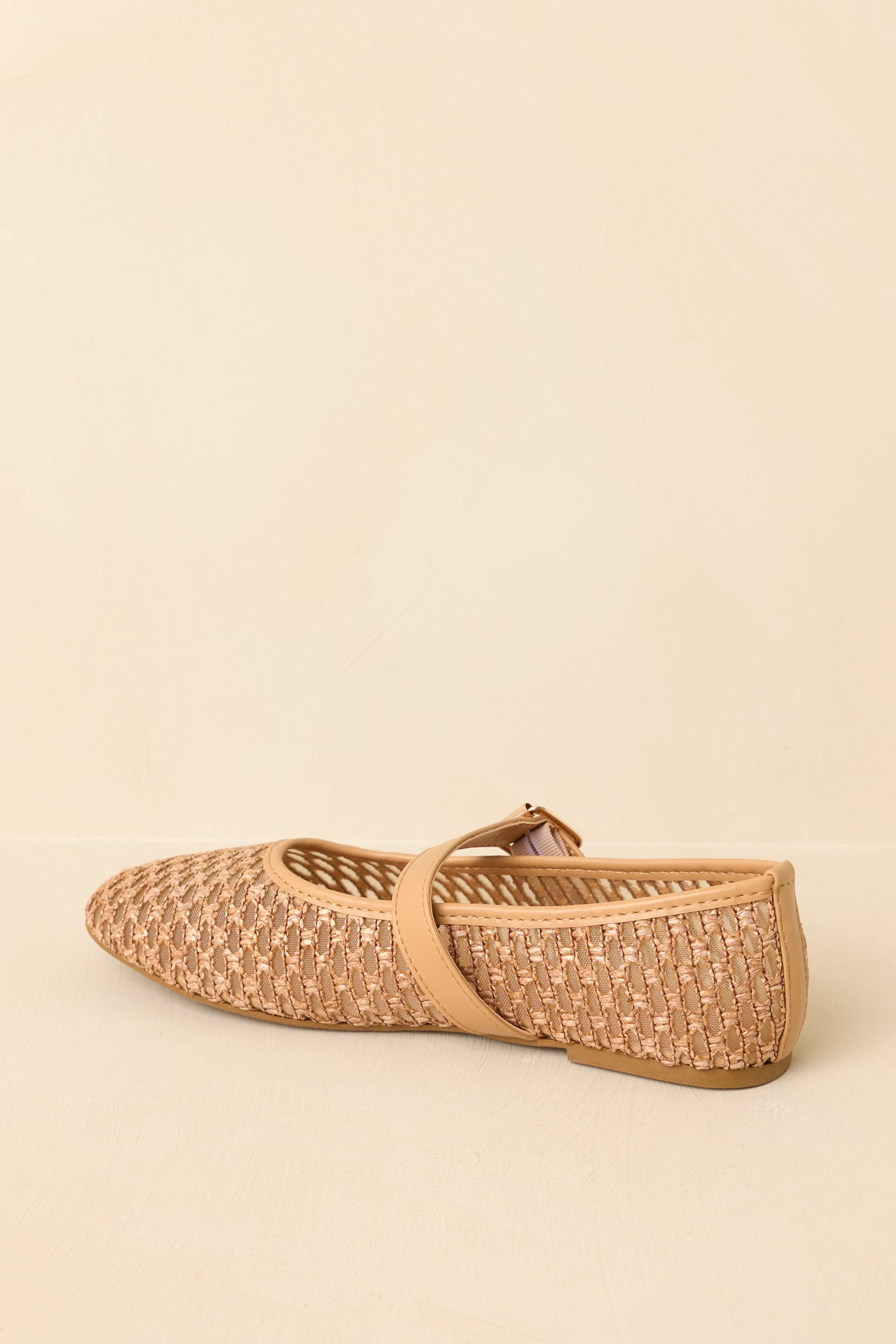 Slight side-rear angle highlighting the strap placement and seamless transition from upper to heel.