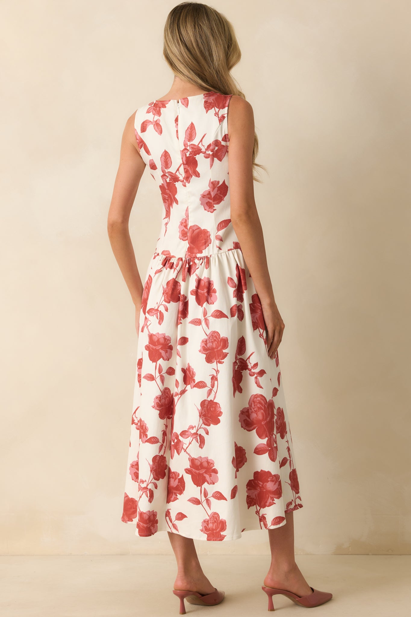 Rear view of the maxi dress highlighting the hidden back zipper closure and drop waist design.
