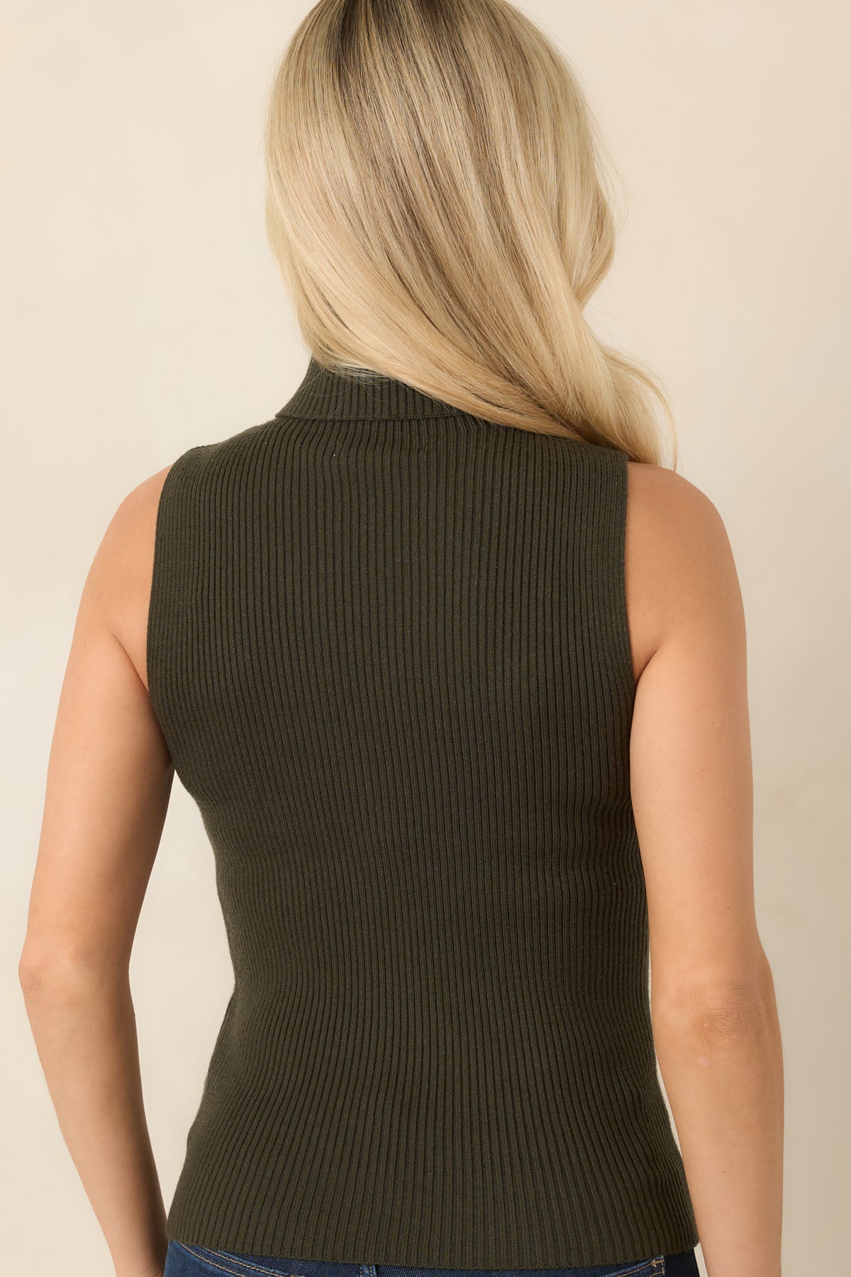 Rear of the olive green ribbed knit top showing its sleeveless shape and hip-length hem.