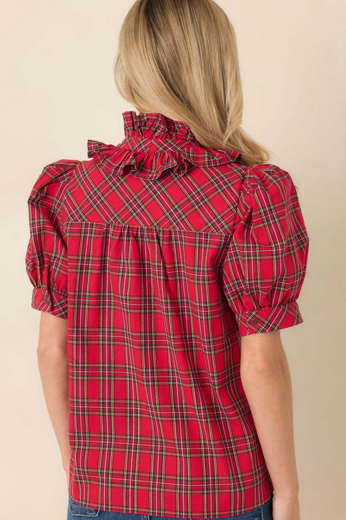 Rear view of the plaid cotton blouse featuring a gathered back yoke and a relaxed silhouette.