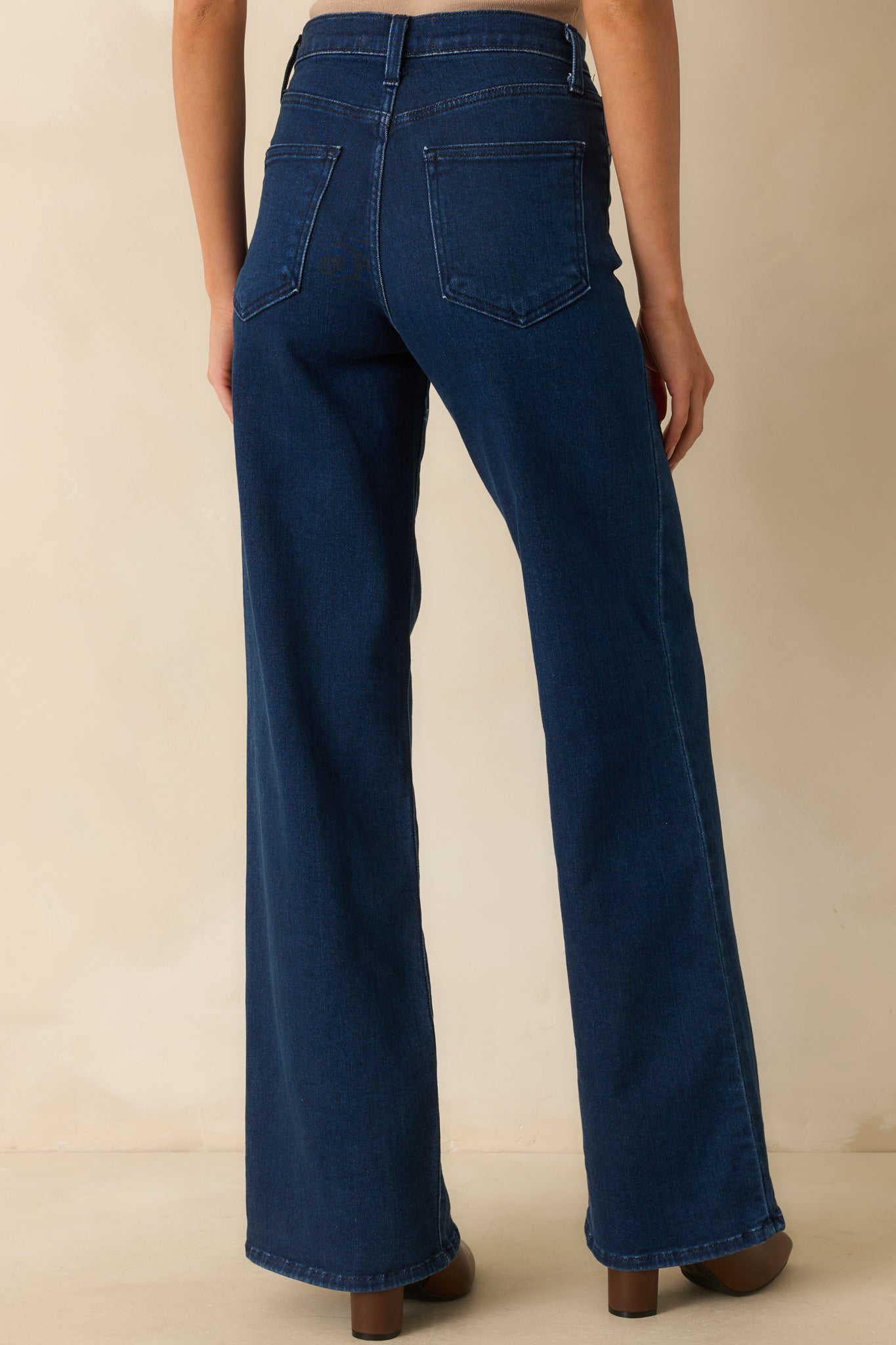 Rear view of the dark wash wide-leg jeans showing the back pockets and relaxed fit.