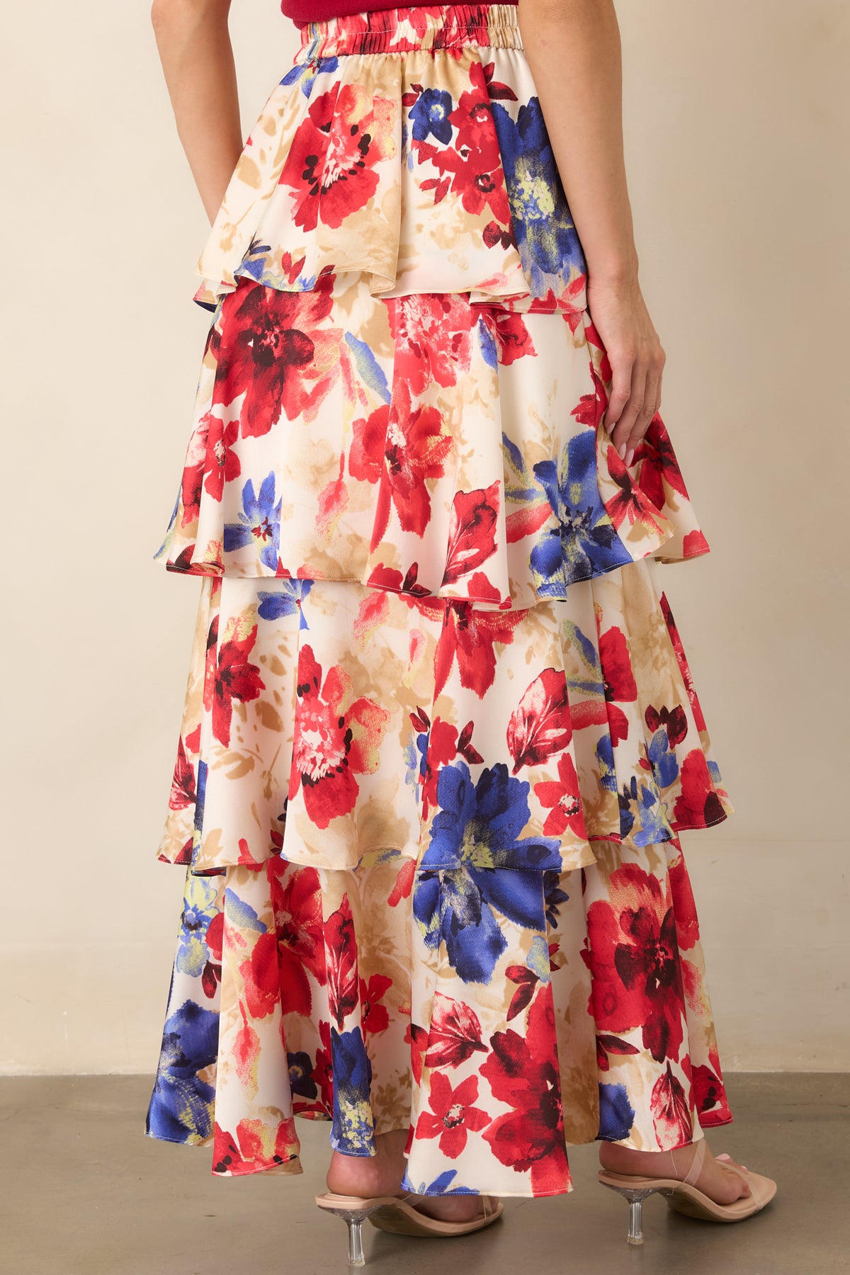 Rear view of the tiered maxi skirt showcasing its elastic back waistband, layered construction, and full flowing silhouette.
