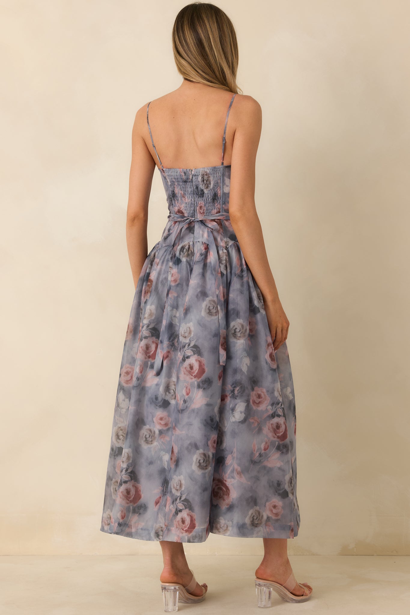 Rear view of grey floral midi dress highlighting hidden back zipper and smooth, lined construction.