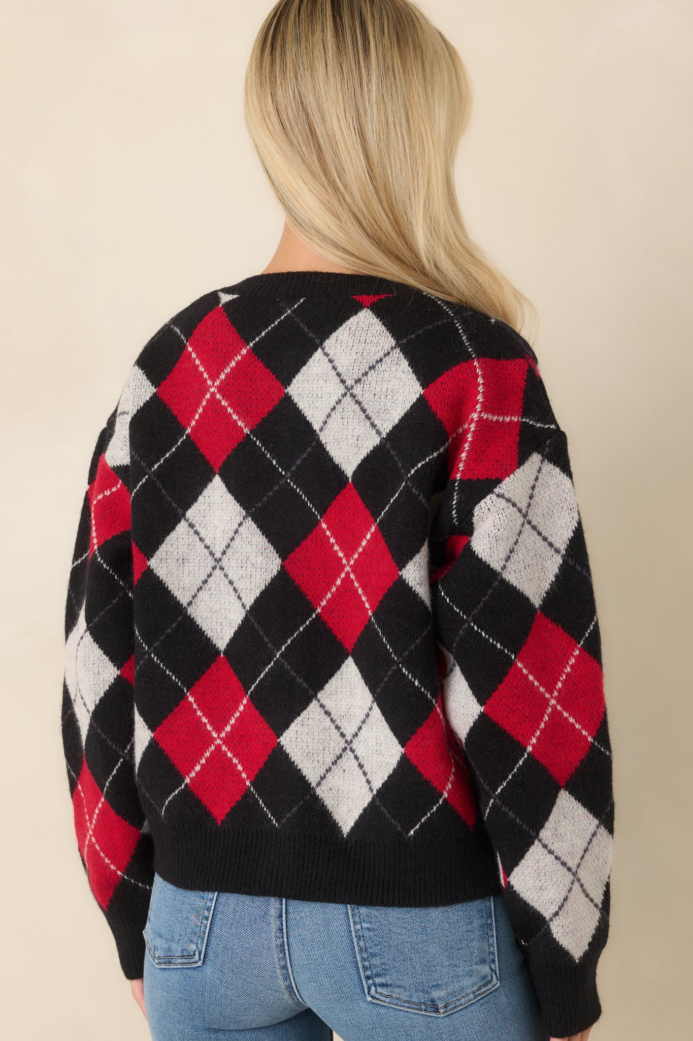 Rear view of the argyle cardigan showcasing the diamond pattern and relaxed dropped shoulder design.