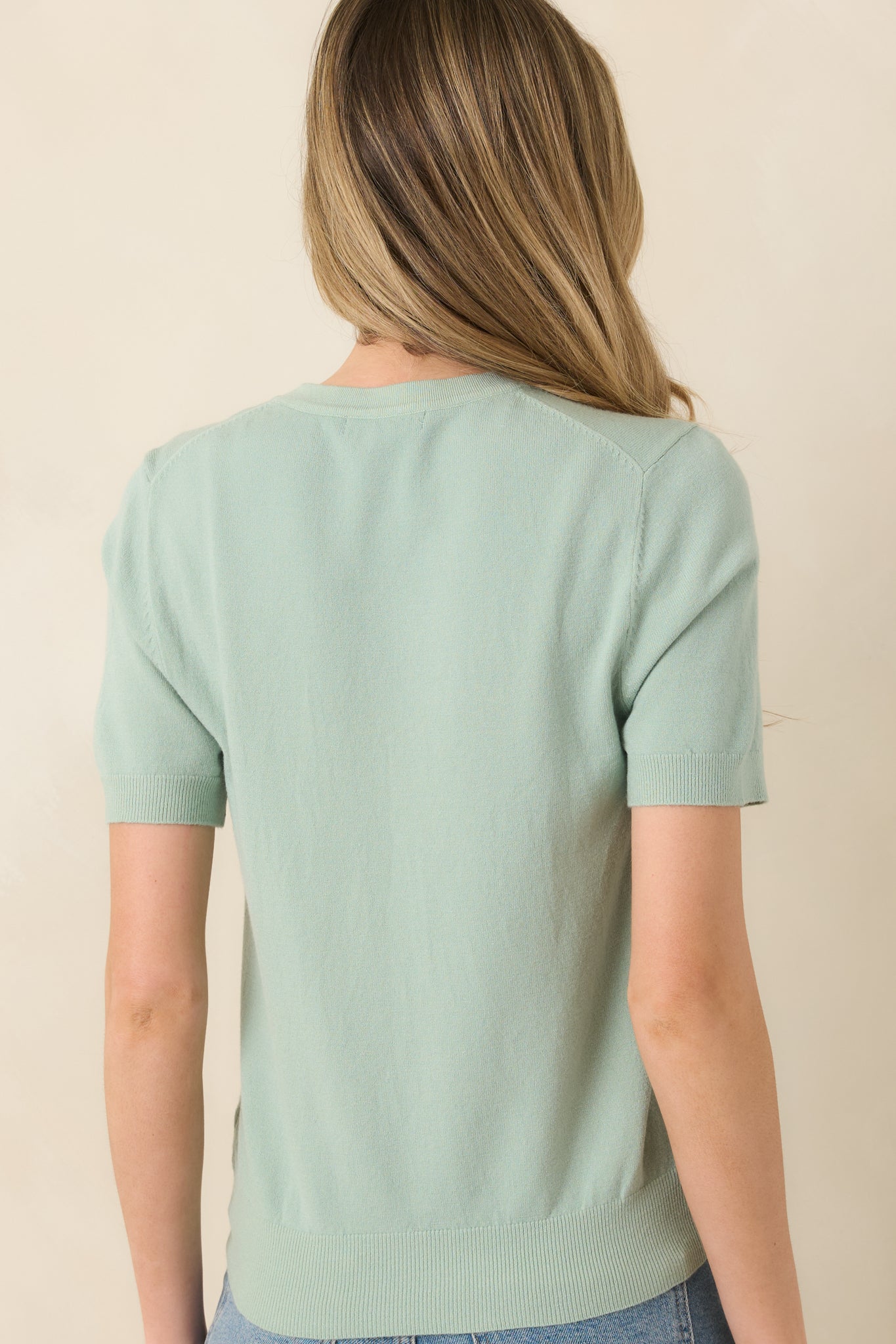 Rear view of lightweight knit tee with smooth, clean silhouette.