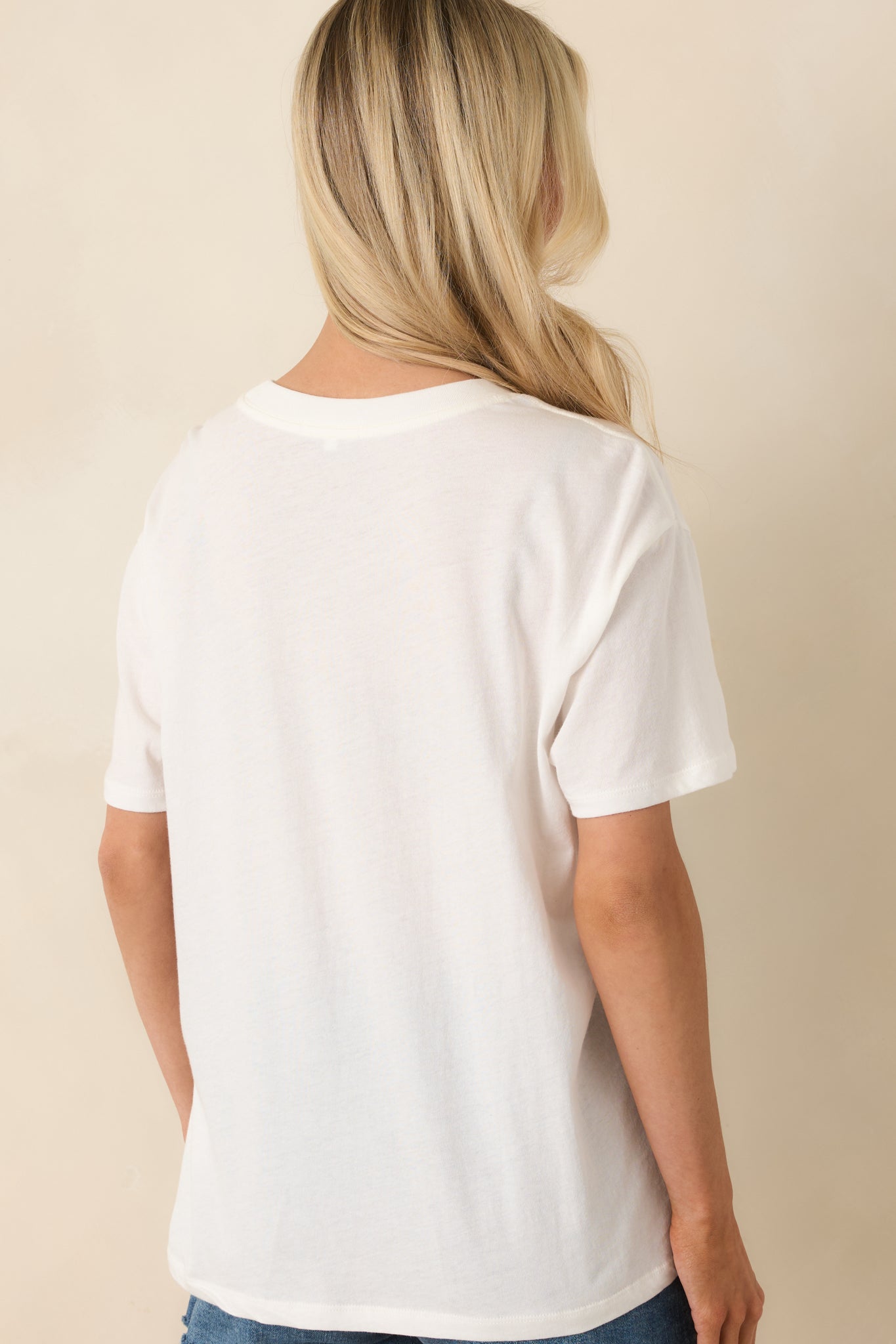 Rear view of soft cotton boyfriend tee with relaxed oversized silhouette and clean design.