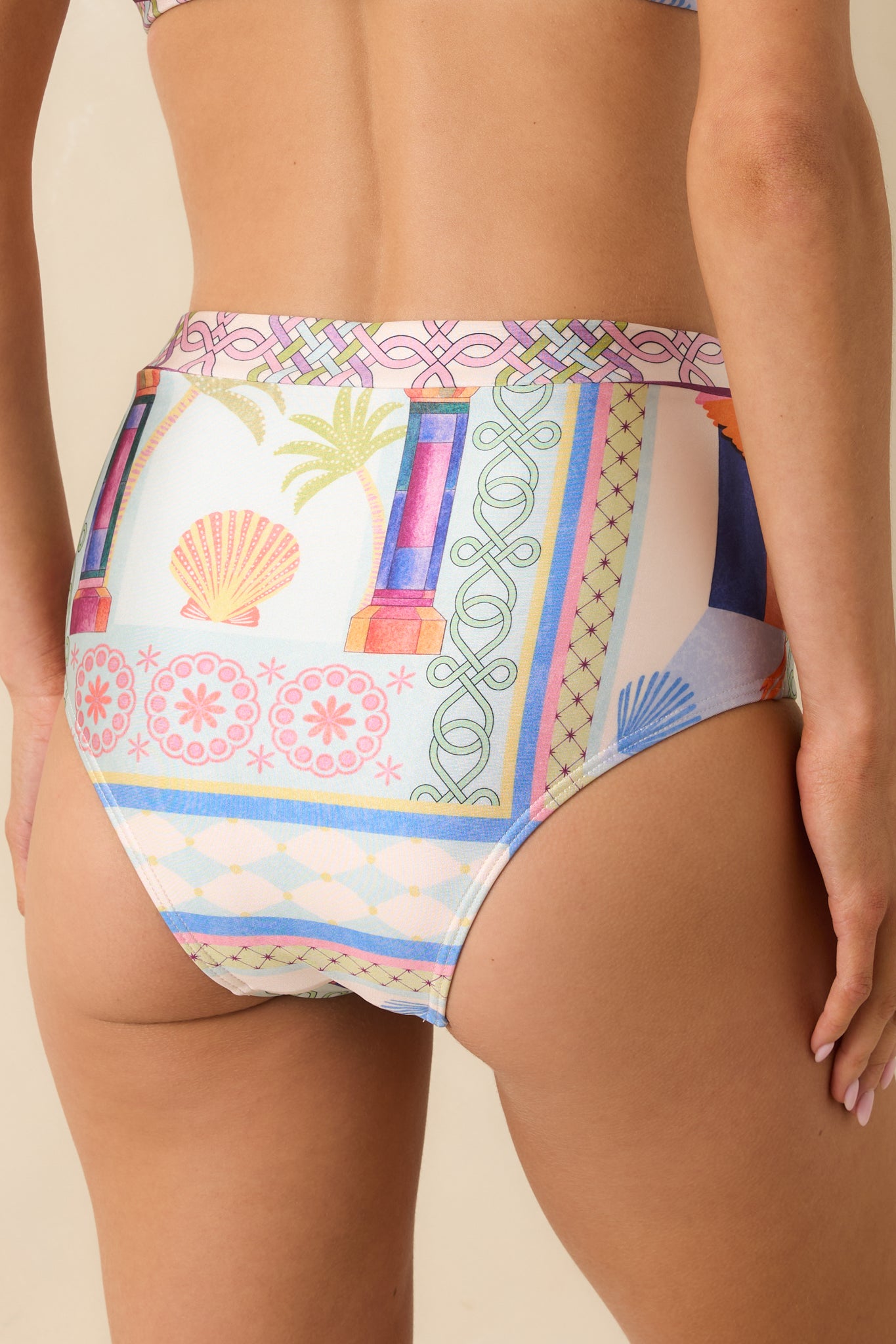 Rear view of the high-waisted bikini bottoms highlighting full back coverage and vibrant pattern.