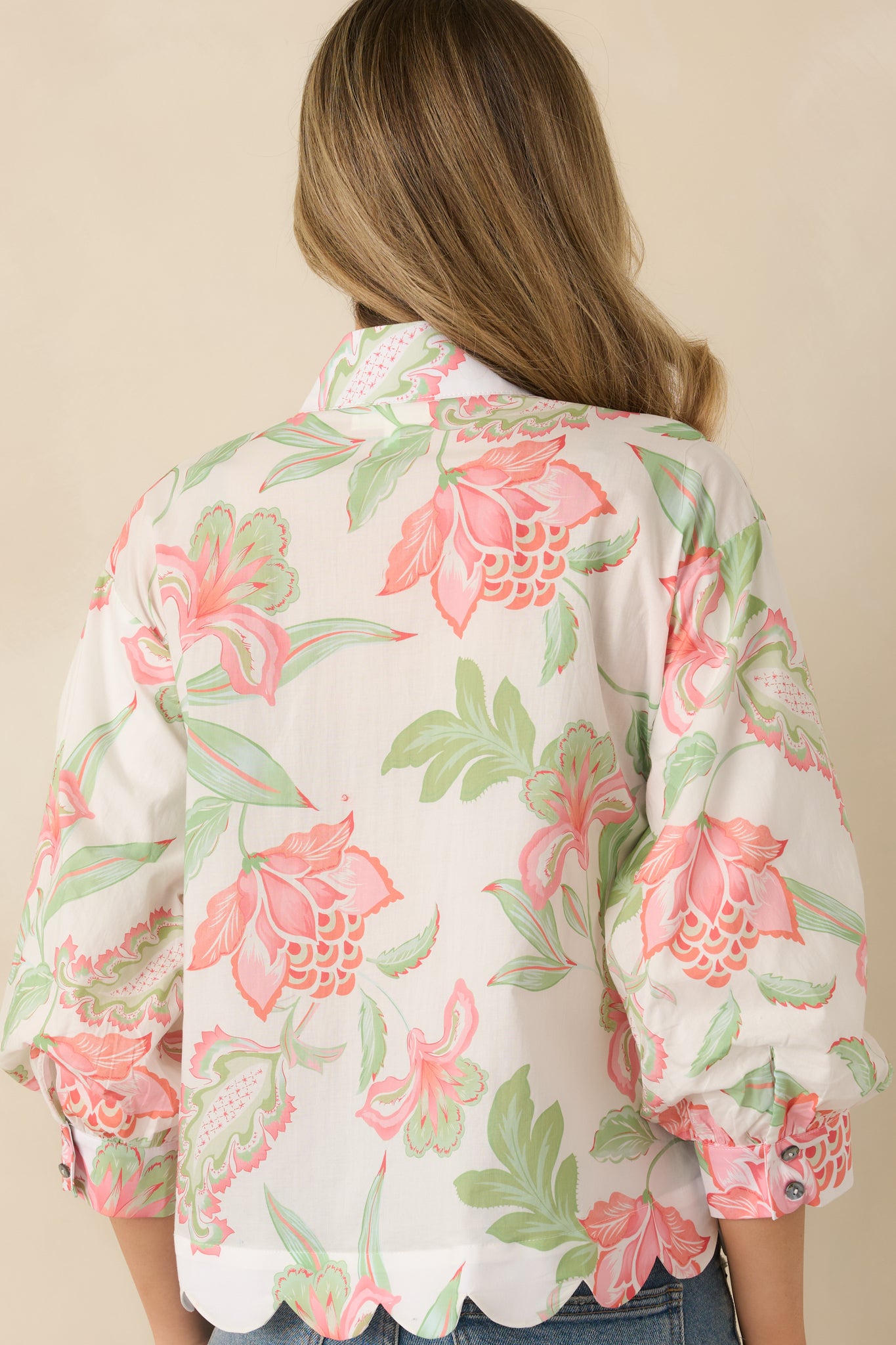 Rear view of the peach multicolor top showing the relaxed silhouette and flowing 3/4 sleeves.