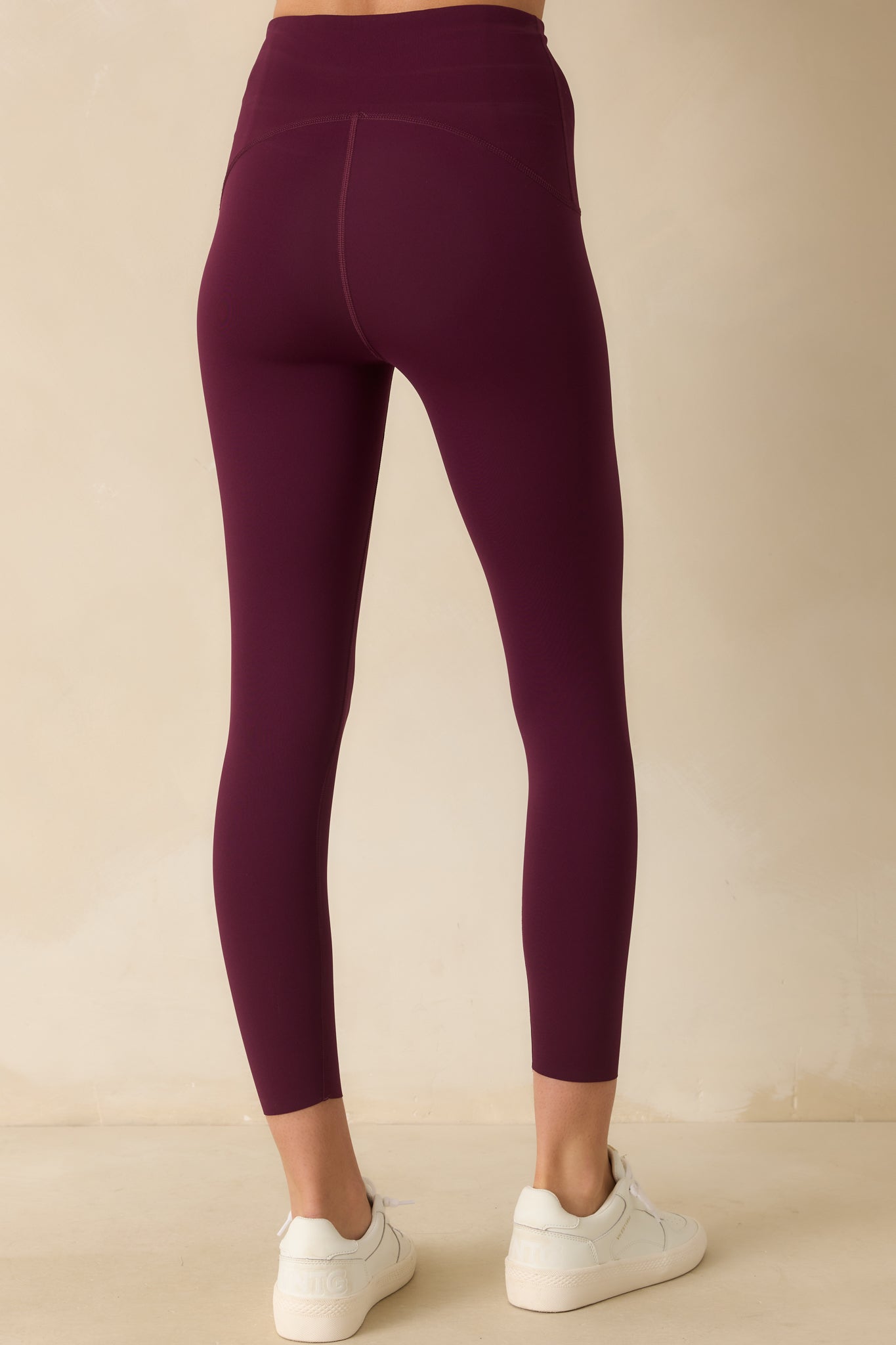 Rear view of the SPANX® 7/8 berry leggings showing the smooth, fitted back and high-rise waistband.