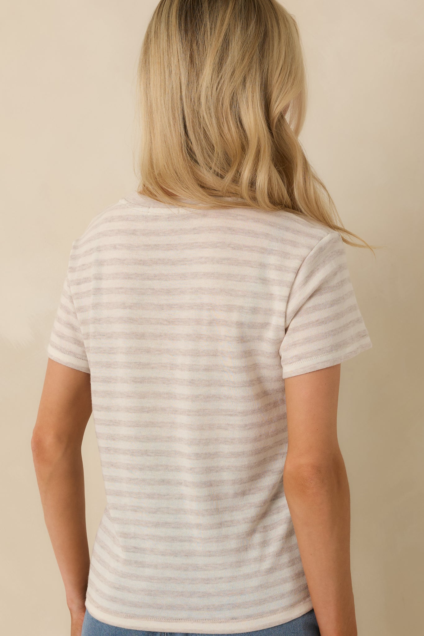 Rear view of the natural heather striped tee showing the relaxed fit, short sleeves, and continuous horizontal stripe pattern.