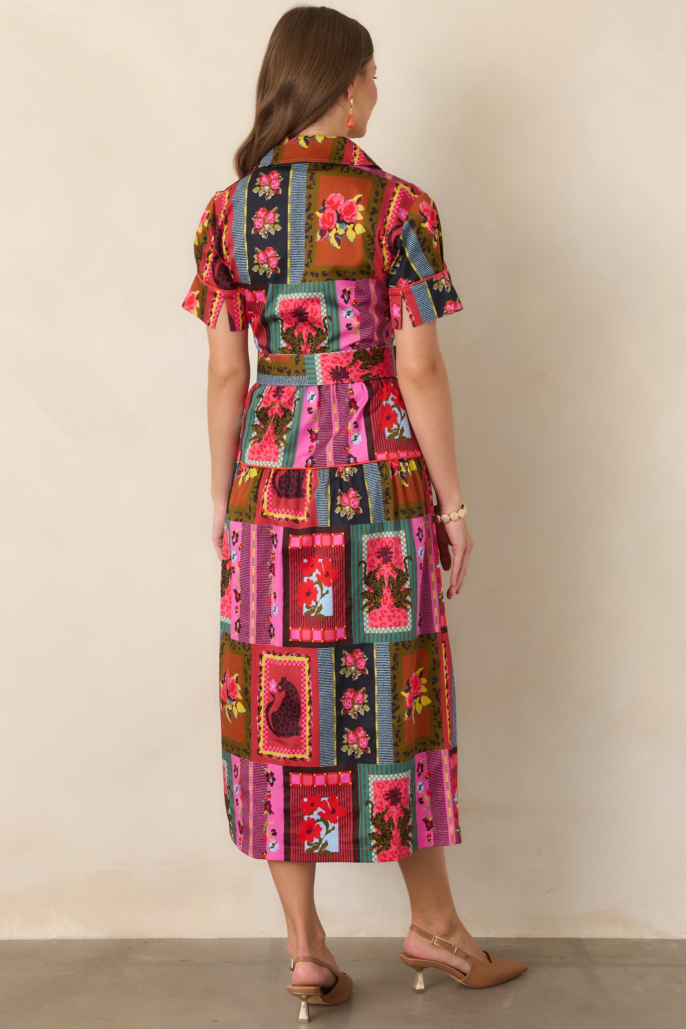 Rear view of the printed cotton-blend dress showcasing the collared neckline, short cuffed sleeves, defined belted waist, and tiered A-line ankle-length skirt.