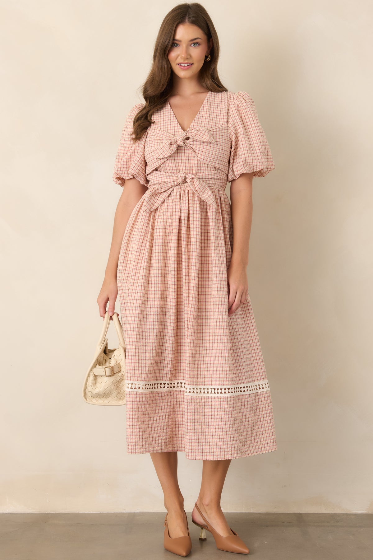 Cotton-blend plaid dress in red and beige with a defined bodice, voluminous puff sleeves, gathered waist, and flowing full midi skirt.