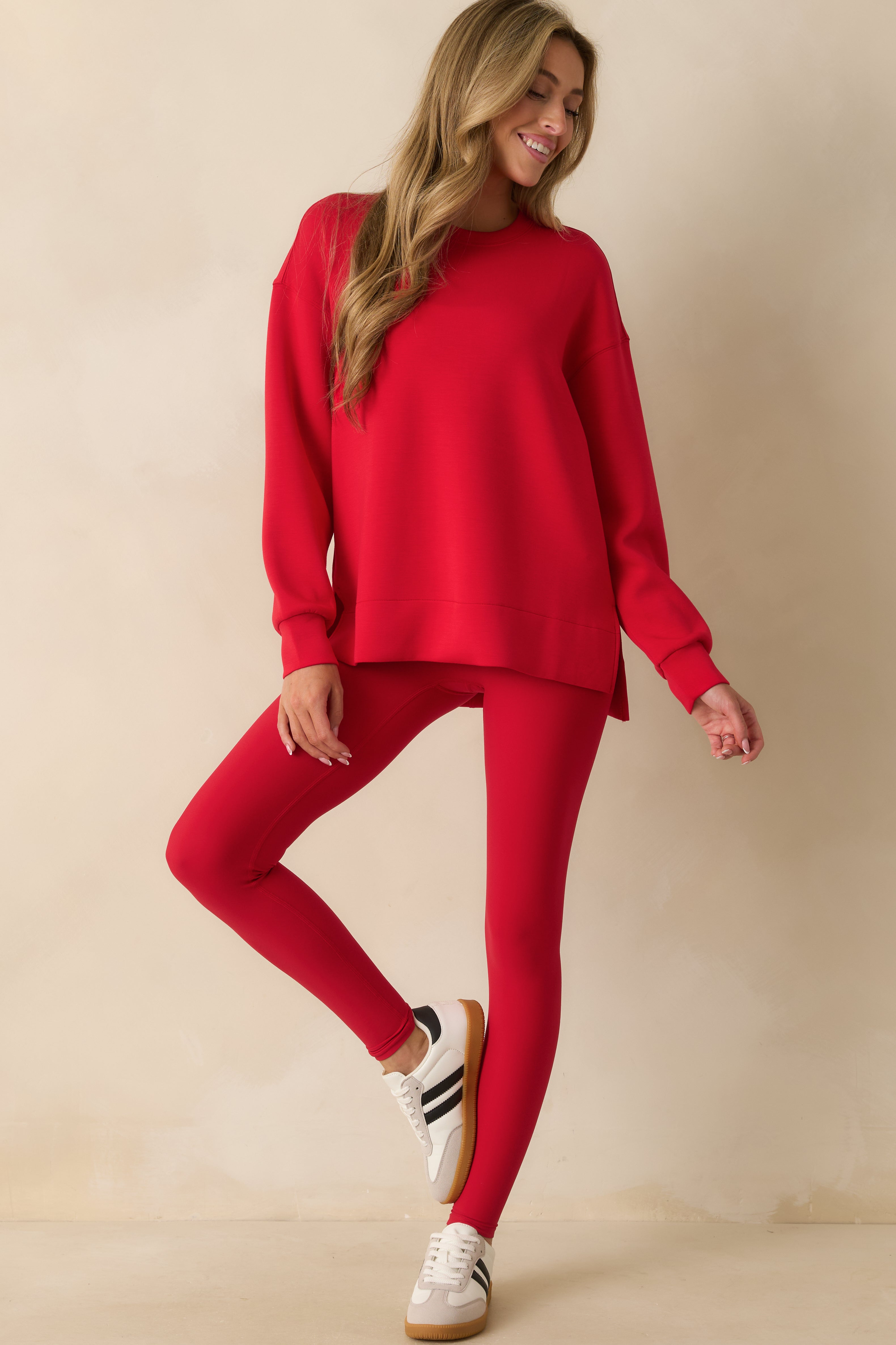 Red crewneck tunic with a relaxed fit and below-the-hip length, crafted from lightweight, drapey spacer fabric.