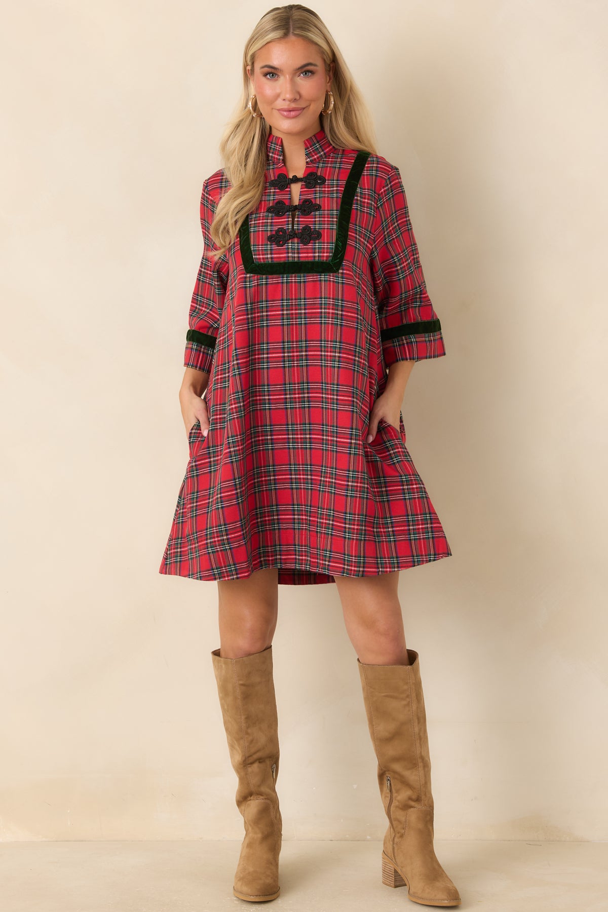 Red and green plaid mini dress with dark green velvet trim, a stand collar, and black braided frog closures.