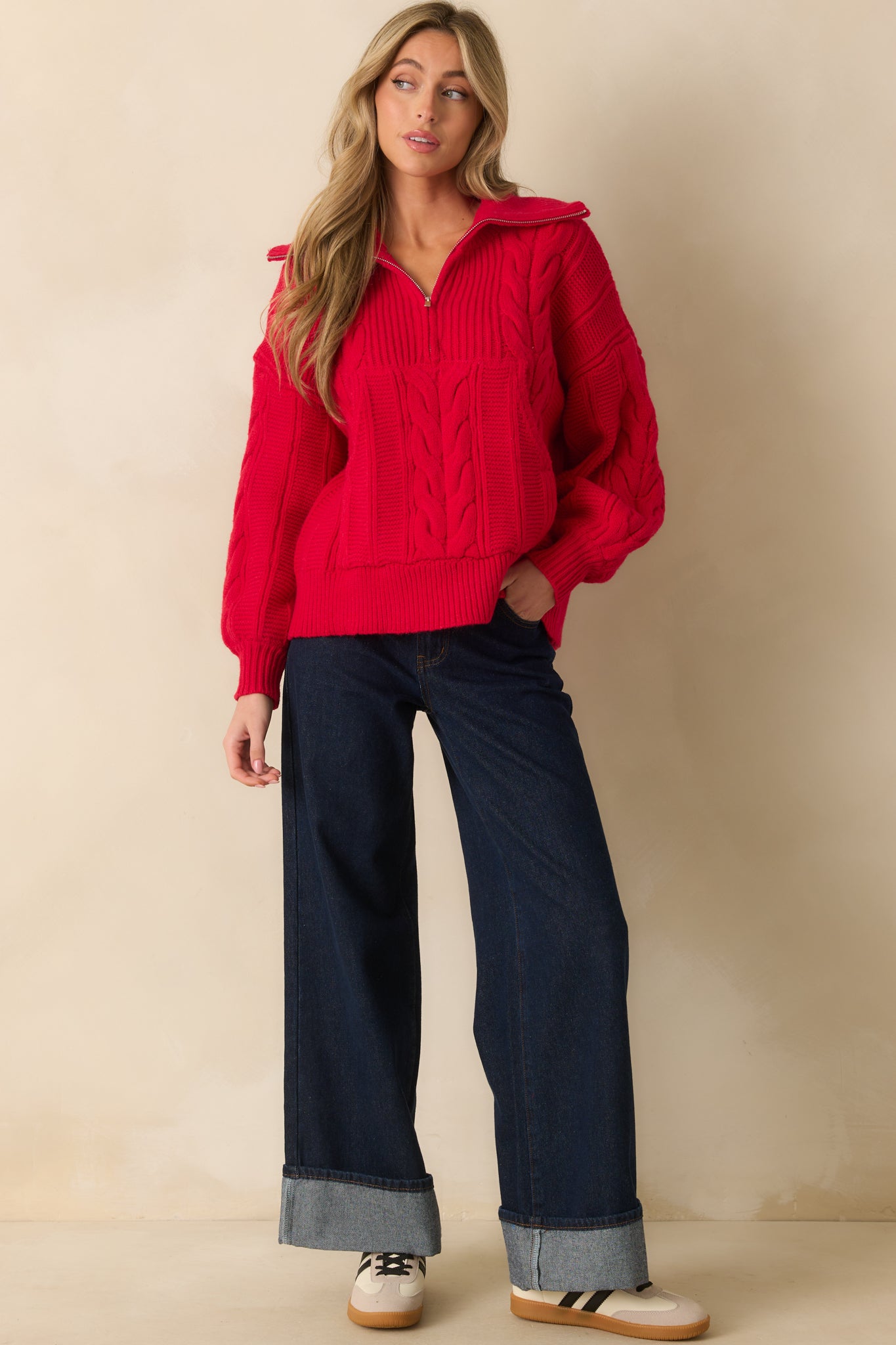 Red knit top highlighting the front kangaroo pocket and cozy cable texture.