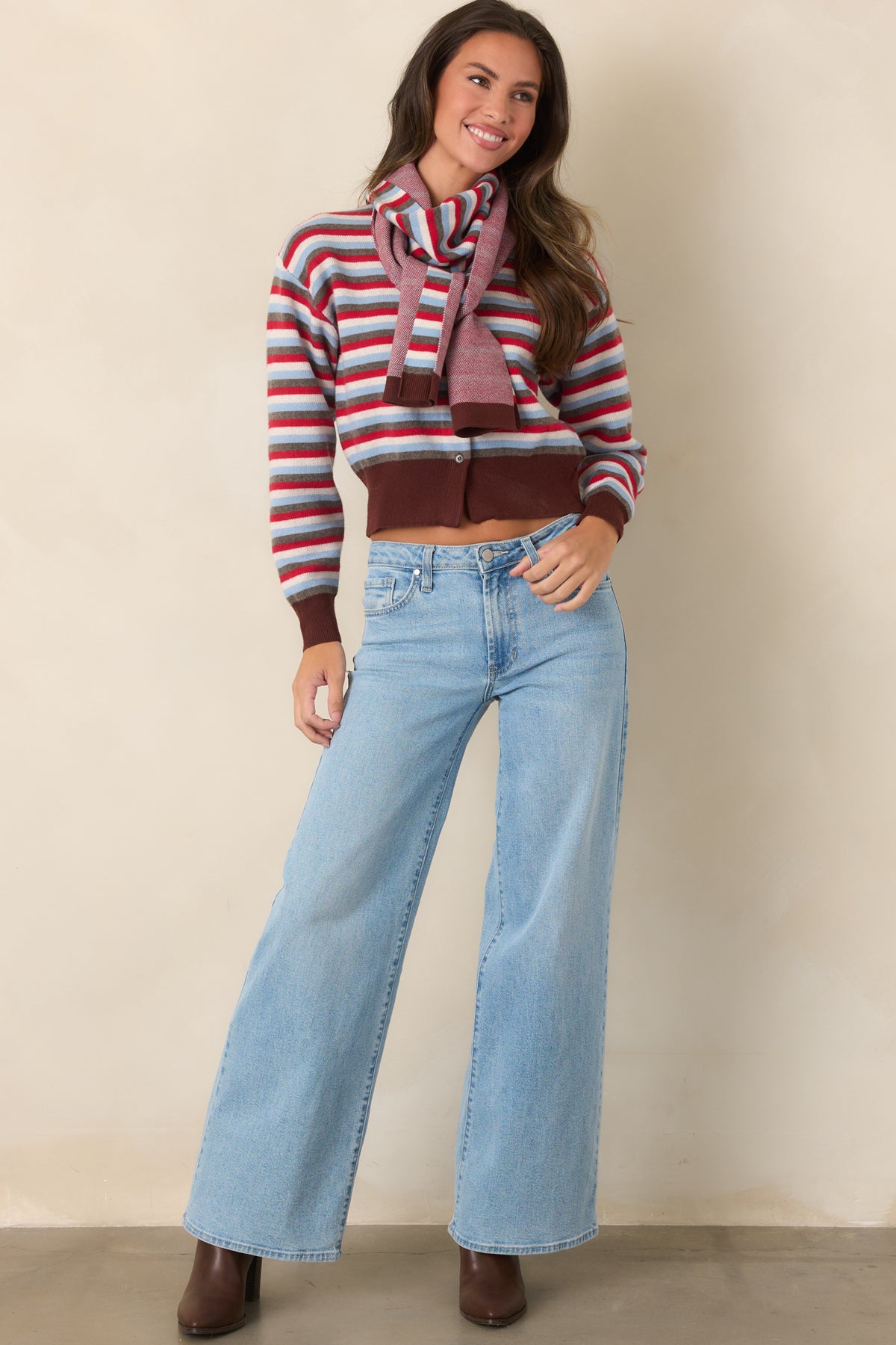 Red, light blue, ivory, and gray stripes create a classic pattern across this relaxed button-front cardigan.