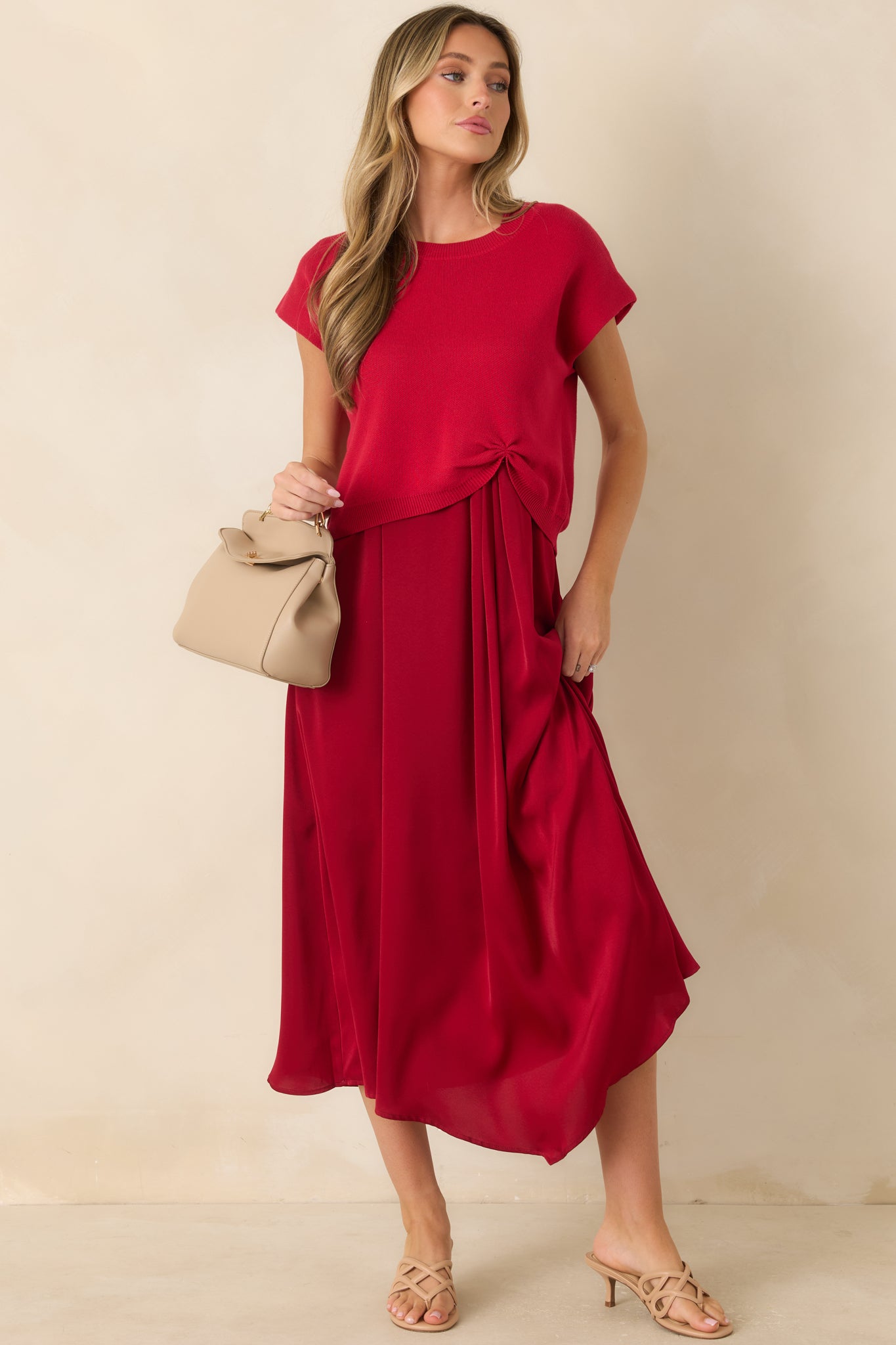 Lightweight red sweater with a soft knit construction, relaxed fit, and subtle gathered detailing at the fron