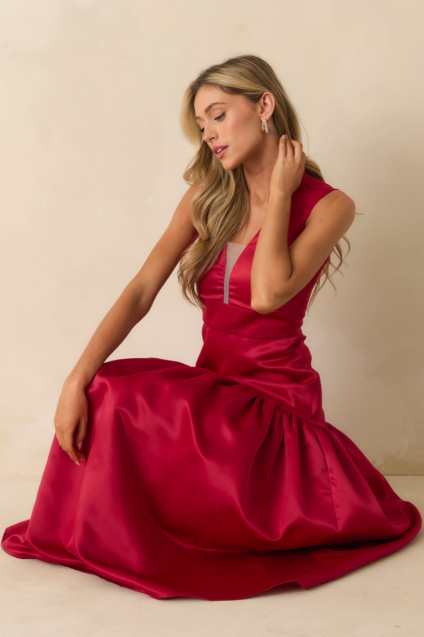 Red maxi dress with a smooth fitted top and elegant, full skirt.